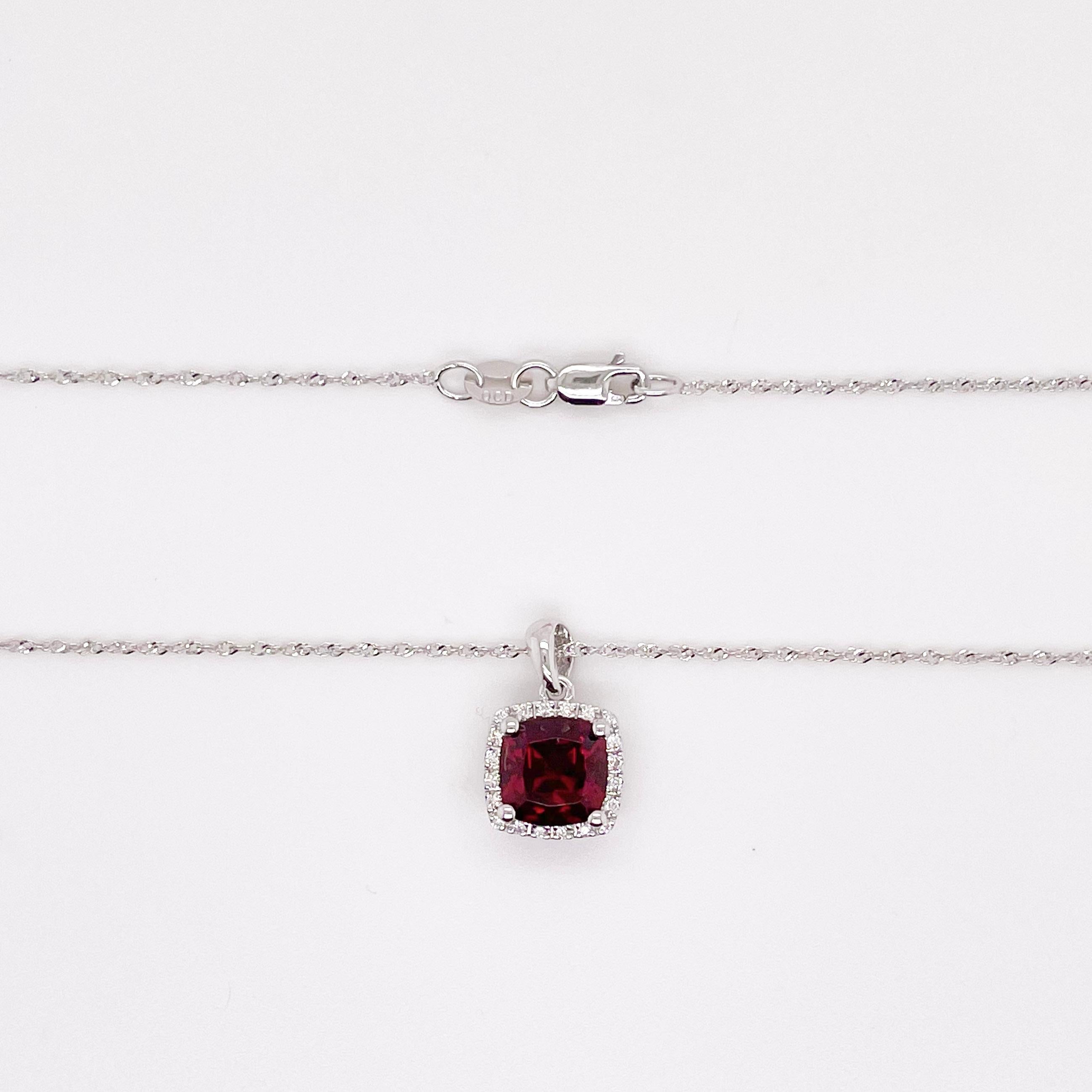 This deep red cushion-cut garnet is breathtaking and set beautifully within a diamond halo. This necklace was designed with a matching ring as shown in the pictures. These two make a stunning set that is the perfect addition to any jewelry