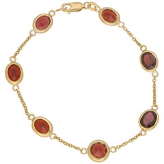 Pulsera de cadena con gafas de granate rojo en oro amarillo de 9 quilates