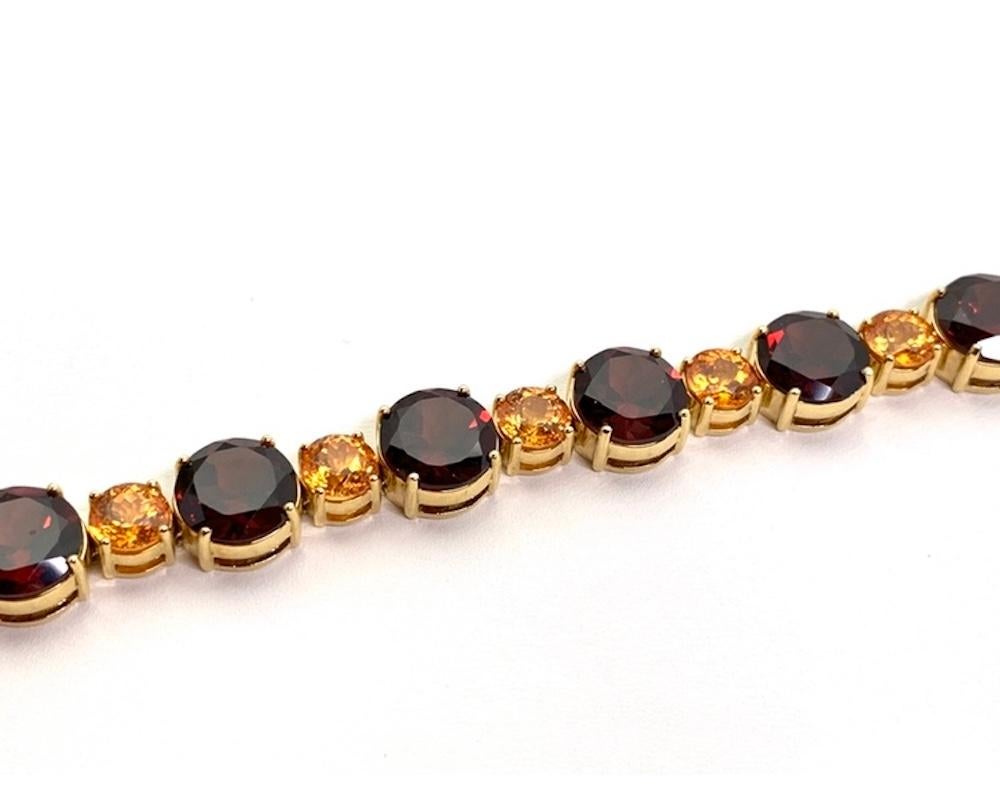Round Cut Spessartite and Red Garnet Tennis Bracelet, 54.87 Carats Total in Yellow Gold For Sale