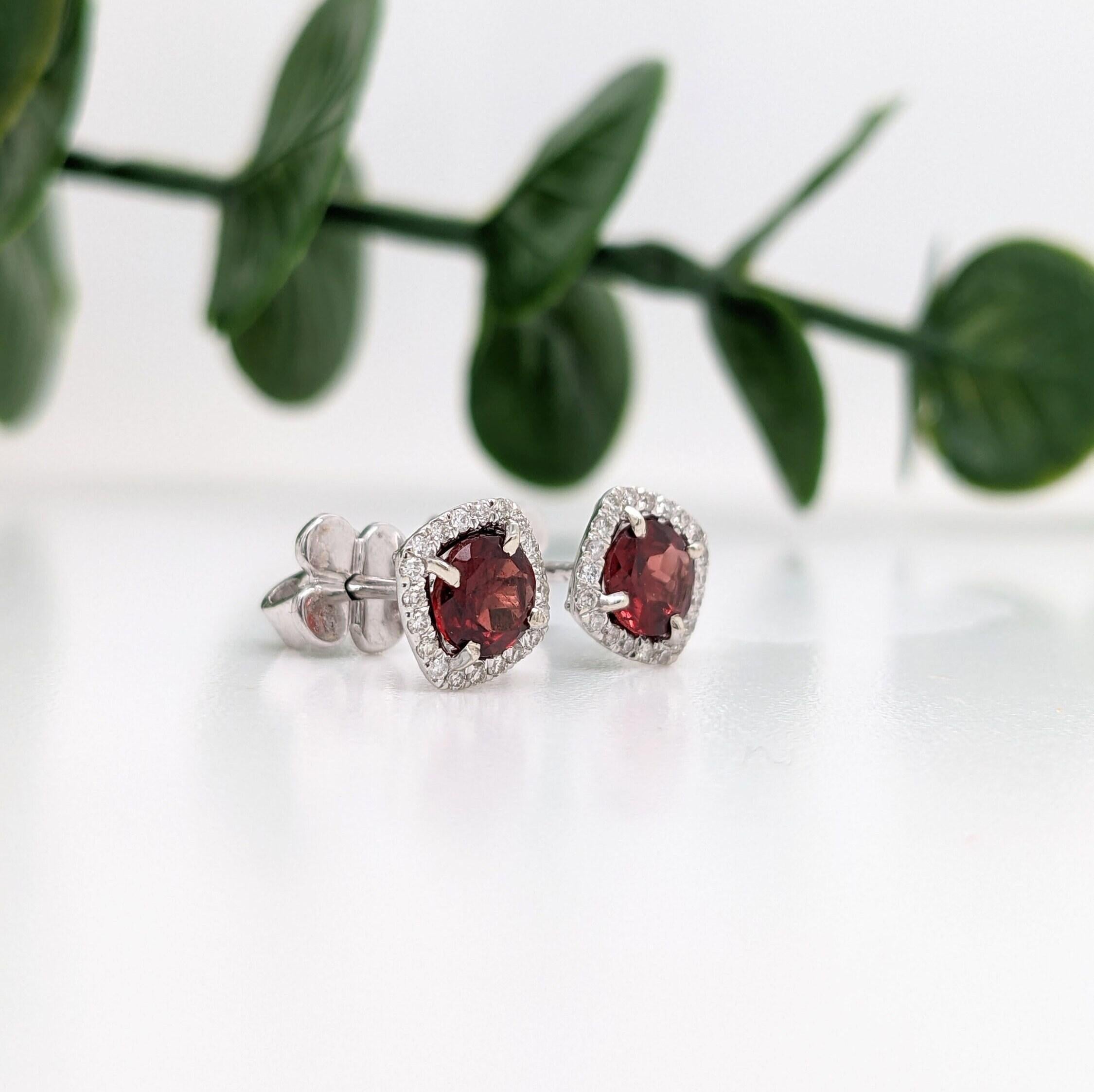 These everyday-wear, pushback studs features a 5mm red garnet gemstone and a natural diamond halo in 14k solid white gold. This piece is available as shown above, or can be customized to fit any stone (choose one from our collection, or use some of