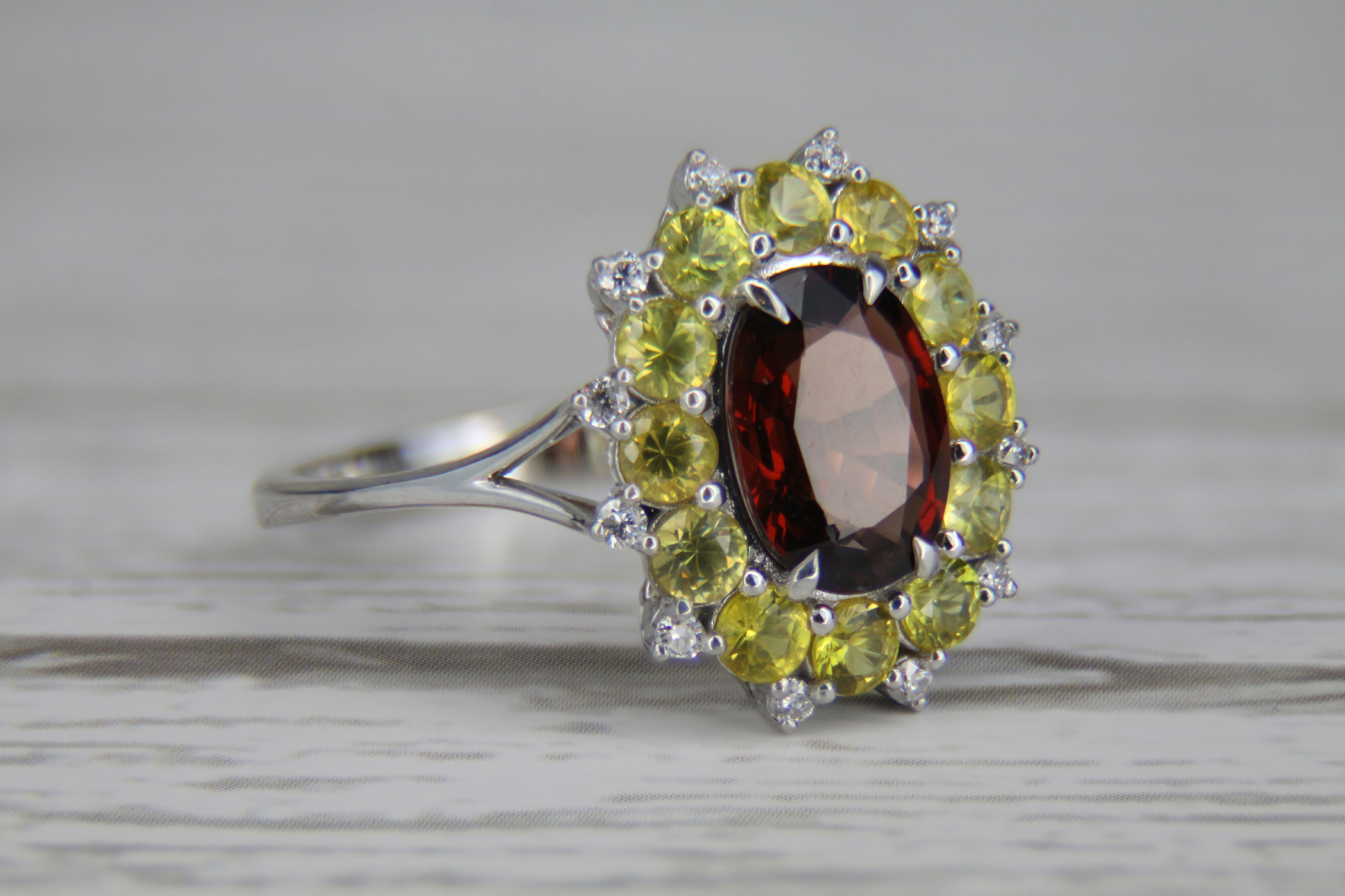 Oval Cut Red garnet, yellow sapphires gold ring.  For Sale