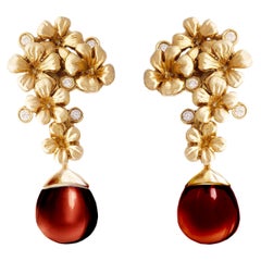 Boucles d'oreilles transformatrices en grenats rouges avec diamants en or jaune 18 carats