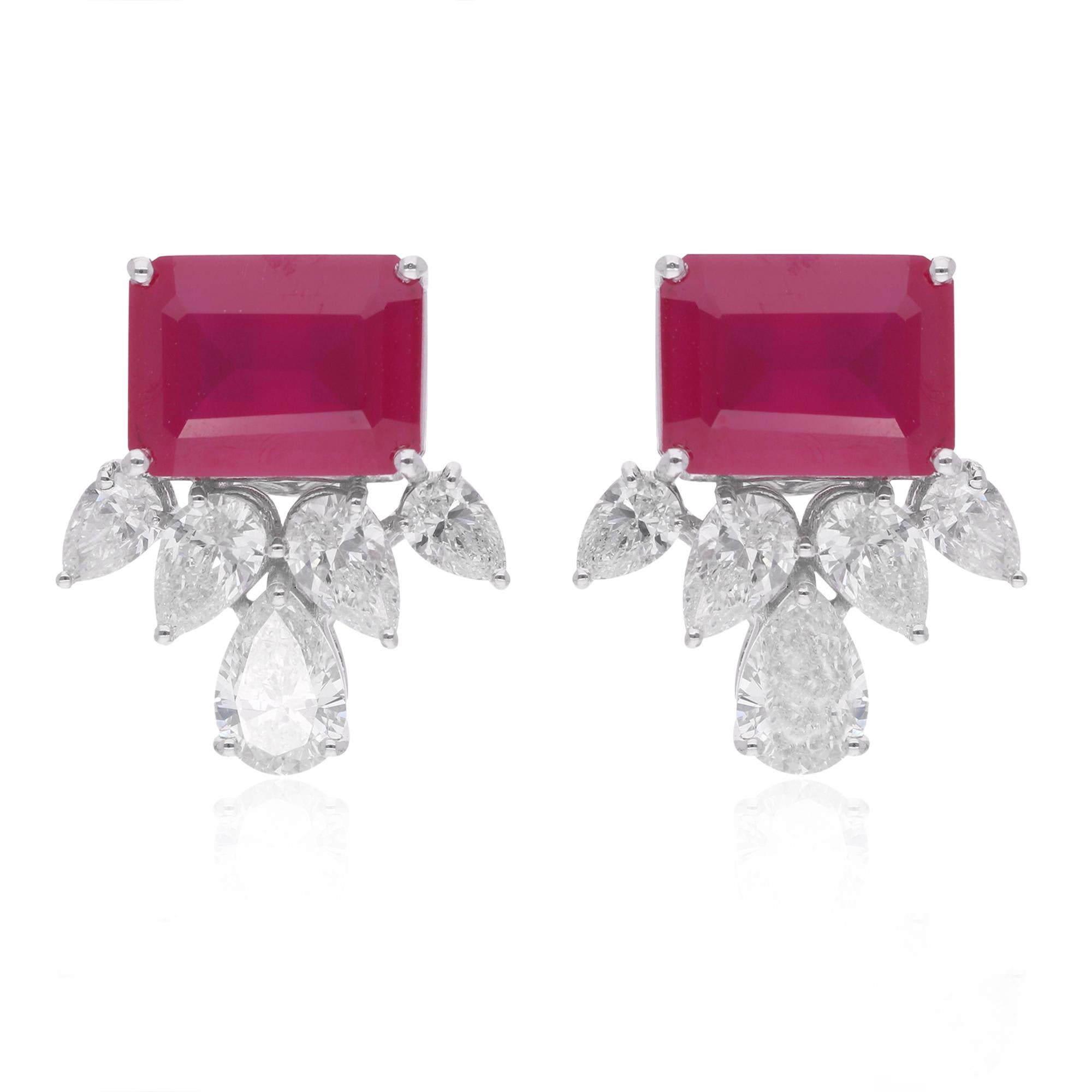 Indulge in the timeless elegance of these Red Gemstone Stud Earrings, adorned with shimmering Pear Diamonds and meticulously handcrafted in radiant 18 Karat White Gold. This exquisite pair of handmade jewelry is a celebration of sophistication and