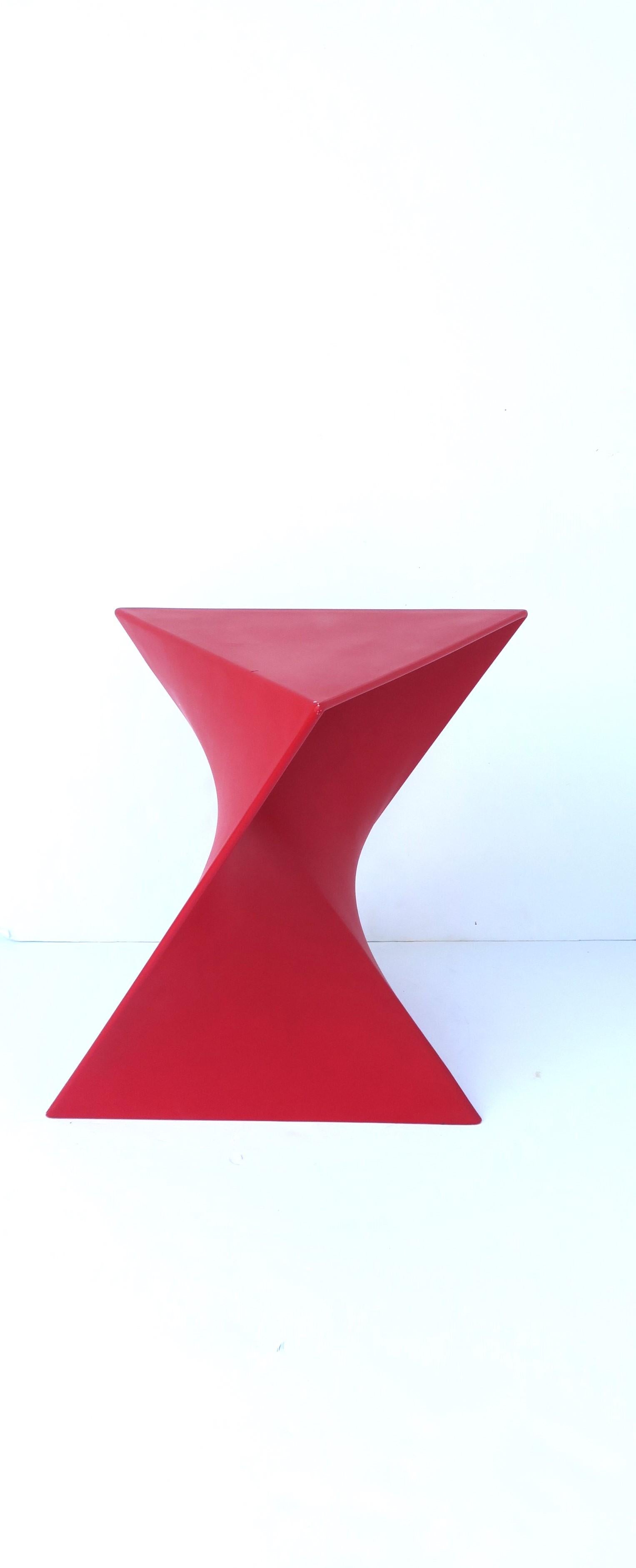 A red geometric side/drinks table, Postmodern period, circa late-20th century. A chic red resin geometric side drinks table. Hue is a 'Coca-Cola' red. A great statement piece for a living room, lounge/sitting area, etc. Piece is a convenient size.