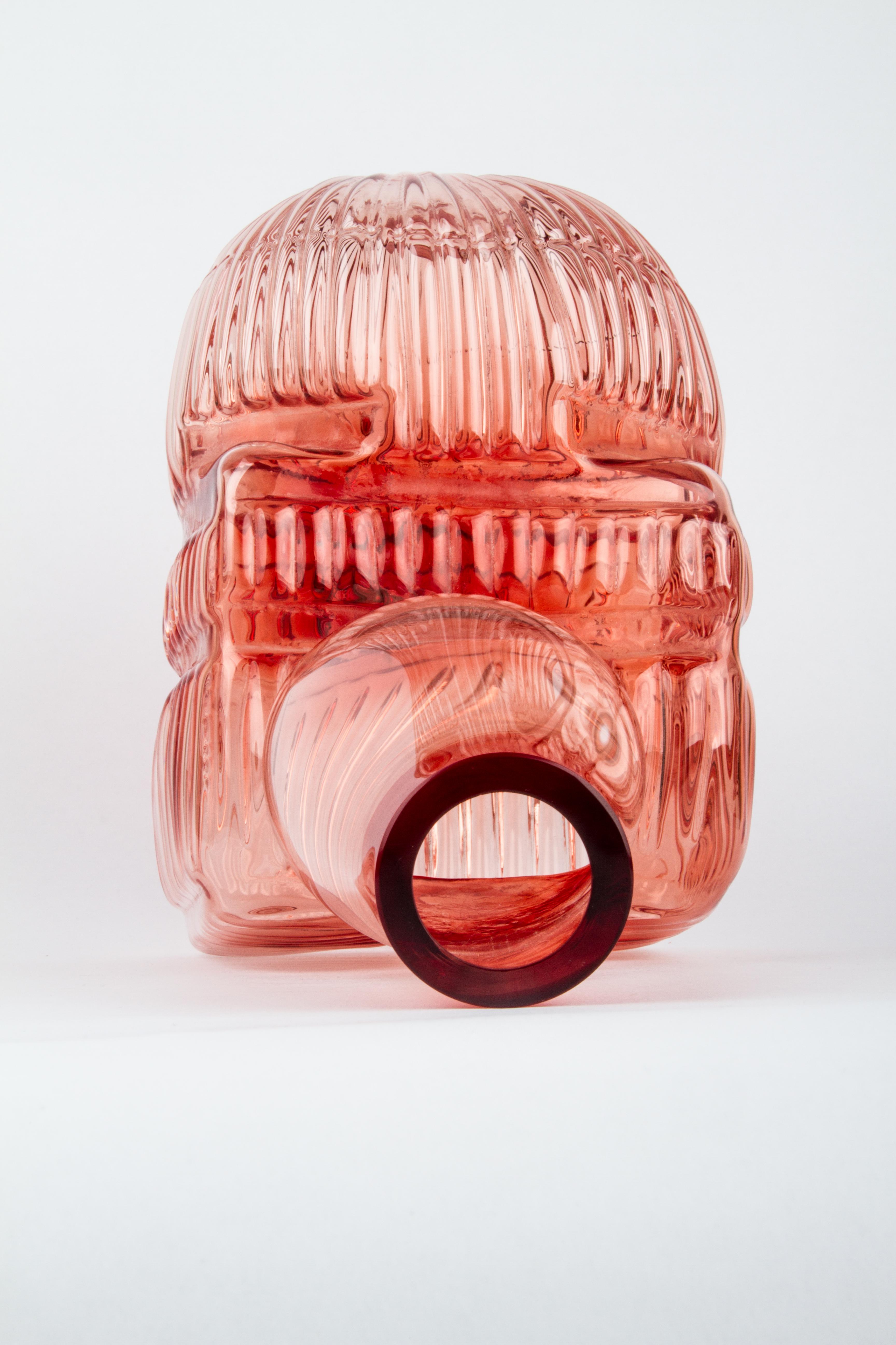 This piece is part of the Out of the Cage Collection, a unique project that was born experimentally in Mexico 11 years ago. 
Liquid glass is blown into various shapes and sizes of “molds” such as birdcages or baskets. The final object is the result