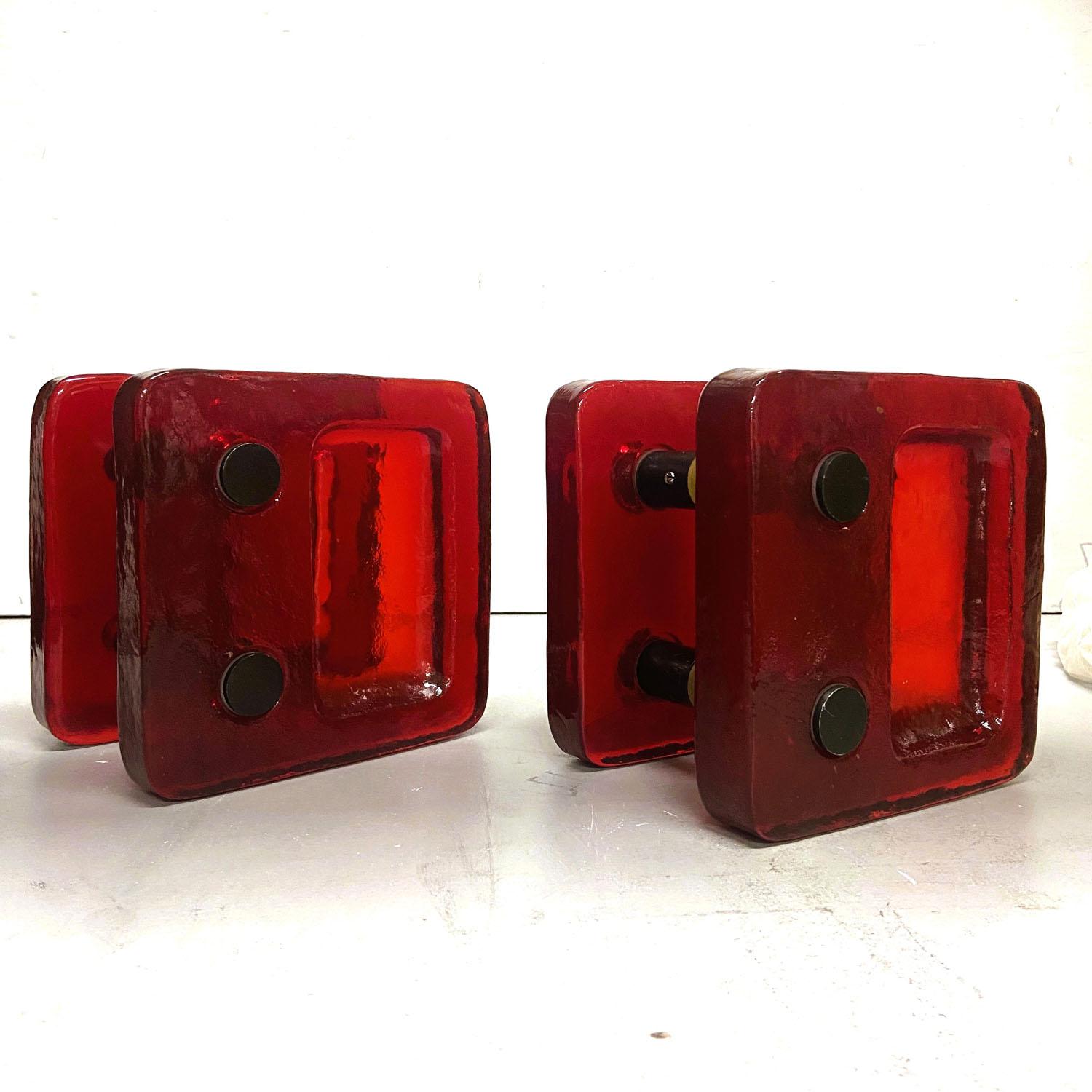 A pair of double door handles, push and pull, square textured vibrant red cast glass with mat antique bronze anodised aluminium. They are designed for a glass or wooden doors but suitable for any kind of doors. The glass slabs are cast by directing