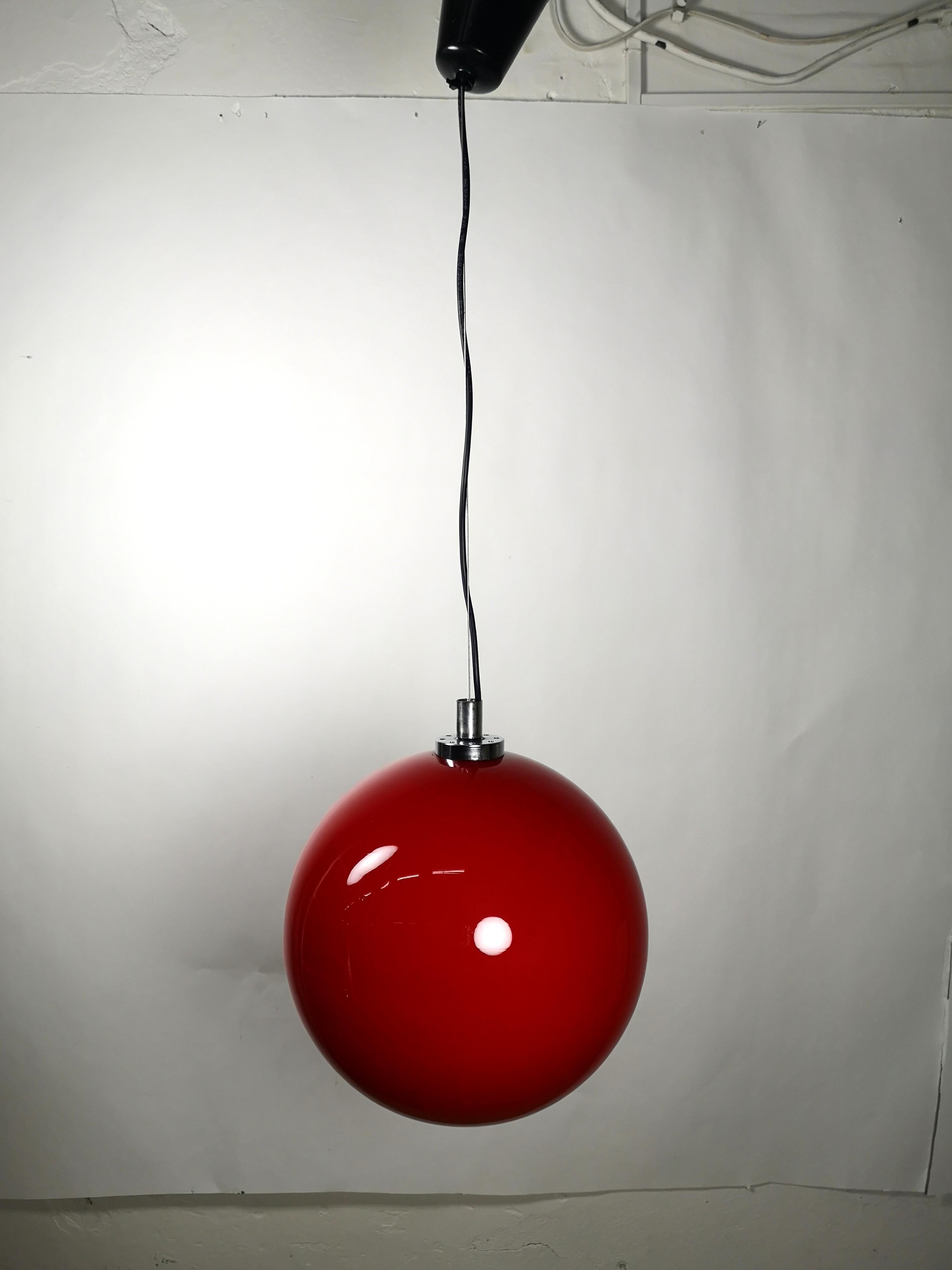 This Italian red glass globe chandelier features a thick colored glass construction, nickel plated accessories and one socket up to 100W's.
It's in excellent condition.