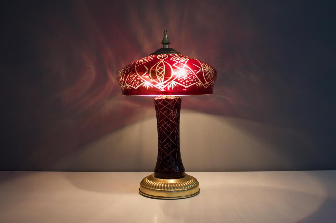 Red glass table lamps with brass base, France, 1950s. 
Very good original condition.