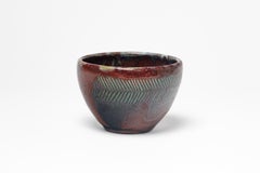 Red glazed ceramic bowl by Jean Maubrou, circa 1940-1950