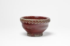 Red glazed ceramic bowl by Jean Maubrou, circa 1940-1950
