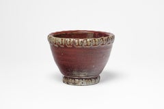 Red glazed ceramic bowl by Jean Maubrou, circa 1940-1950