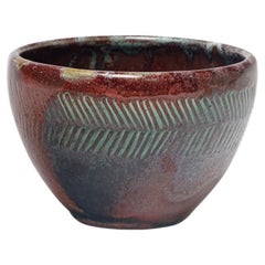 Red glazed ceramic bowl by Jean Maubrou, circa 1940-1950