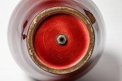 Red glazed ceramic table lamp by Pol Chambost, circa 1930-1950.