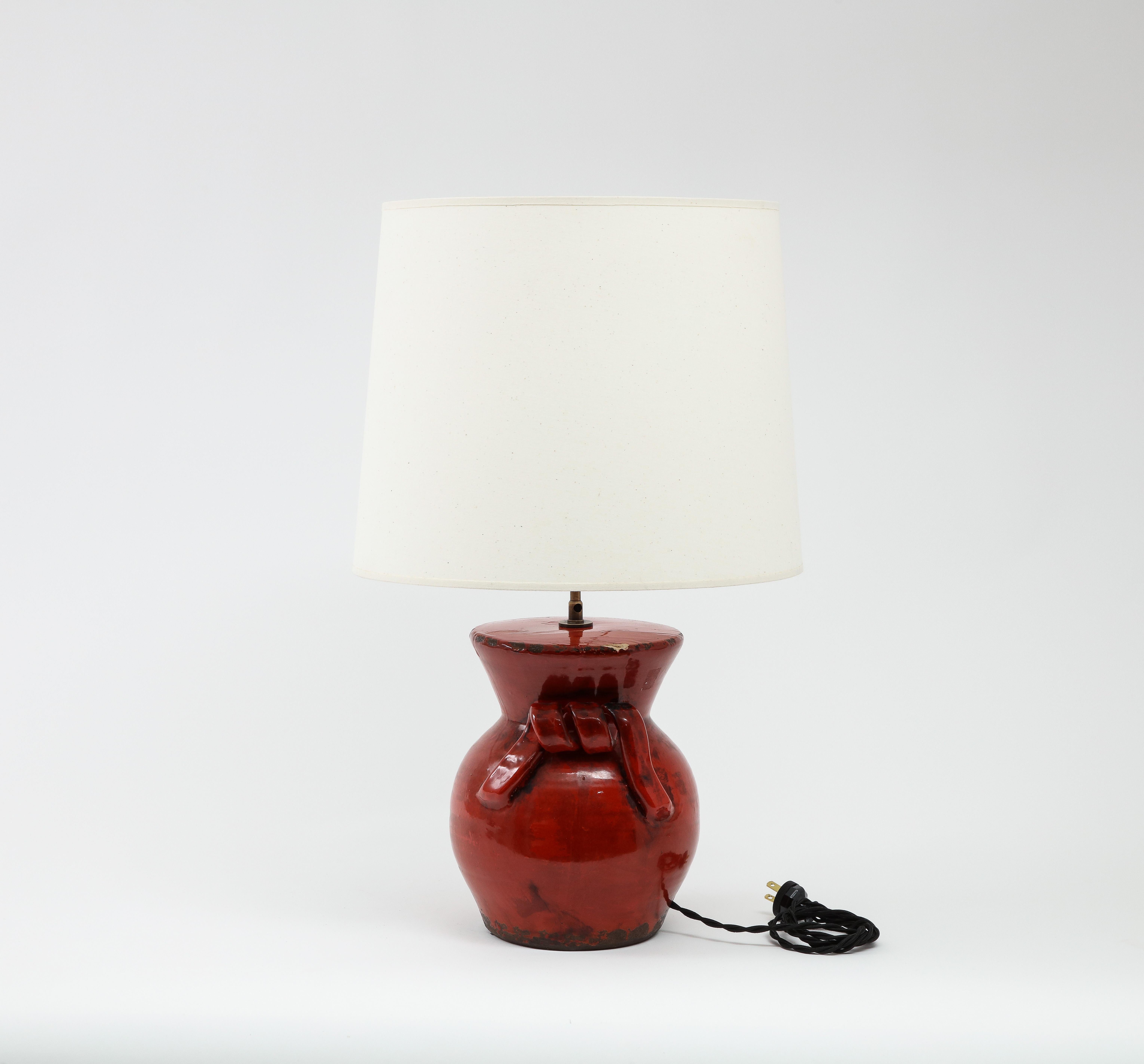 Rustic ceramic lamp in deep red glaze with ribbon style 