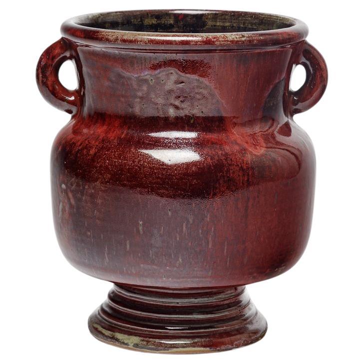 Red glazed ceramic vase by Jean Maubrou, circa 1940-1950