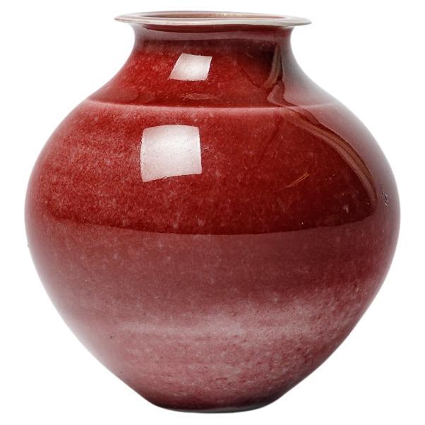 Red glazed ceramic vase by Robert Deblander, circa 1990.