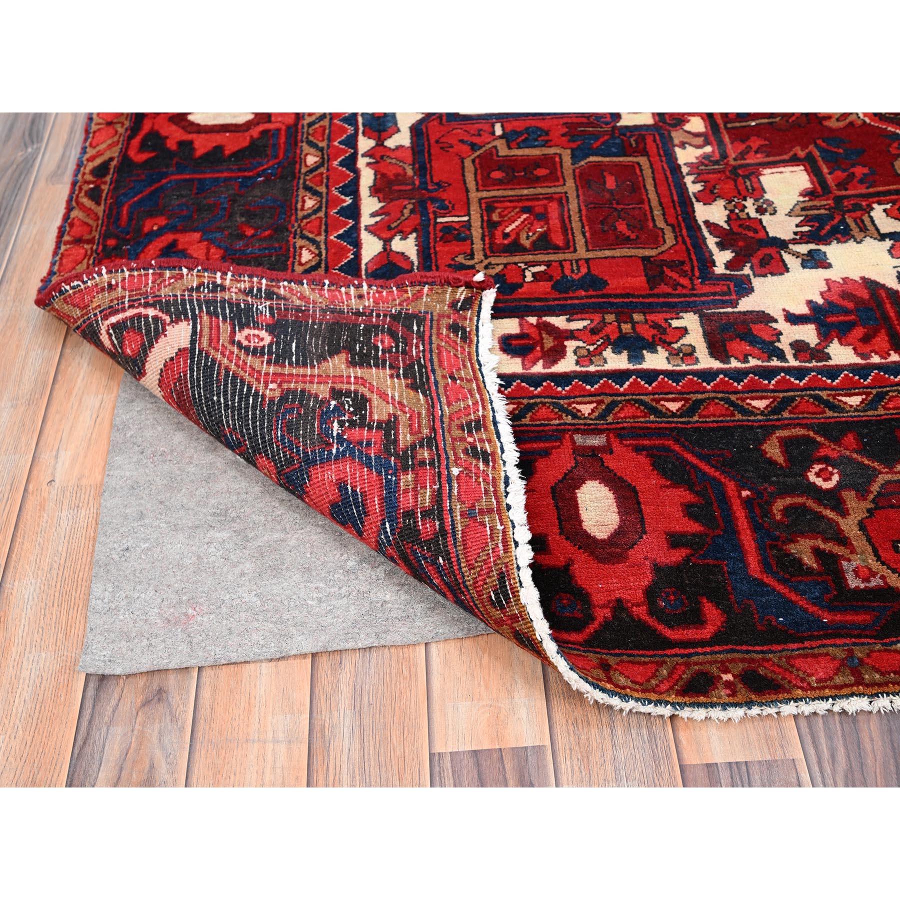 Mid-20th Century Red Hand Knotted Vintage Bohemian Persian Heriz Rustic Feel Evenly Worn Wool Rug For Sale