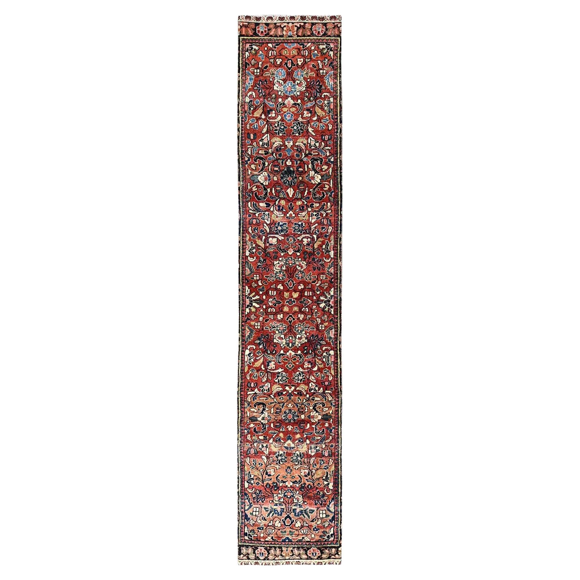 Red Hand Knotted Vintage Persian Lilahan Distressed Look Wool Narrow Runner Rug For Sale