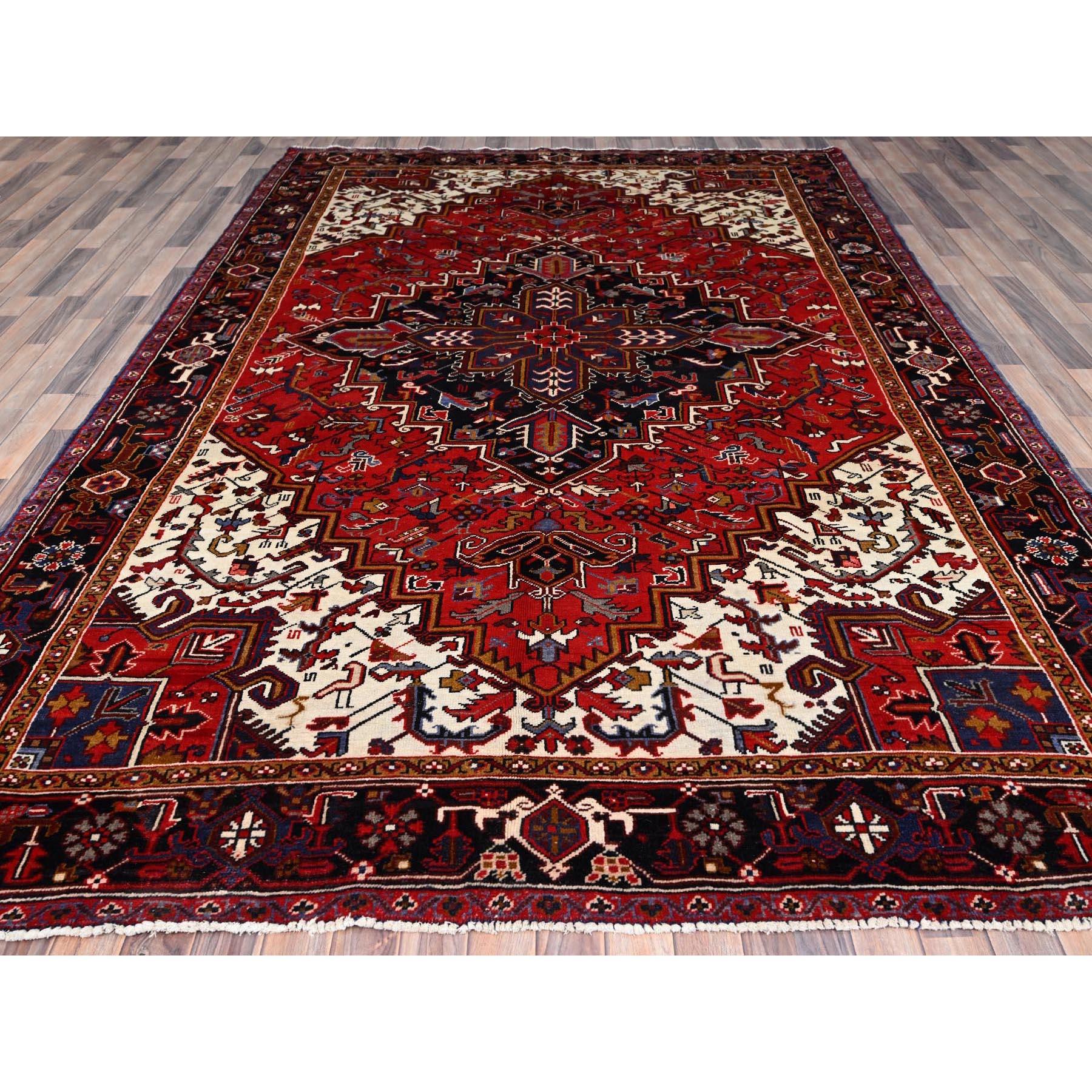 Medieval Red Hand Knotted Worn Down Vintage Wool Persian Heriz with Tribal Ambience Rug For Sale