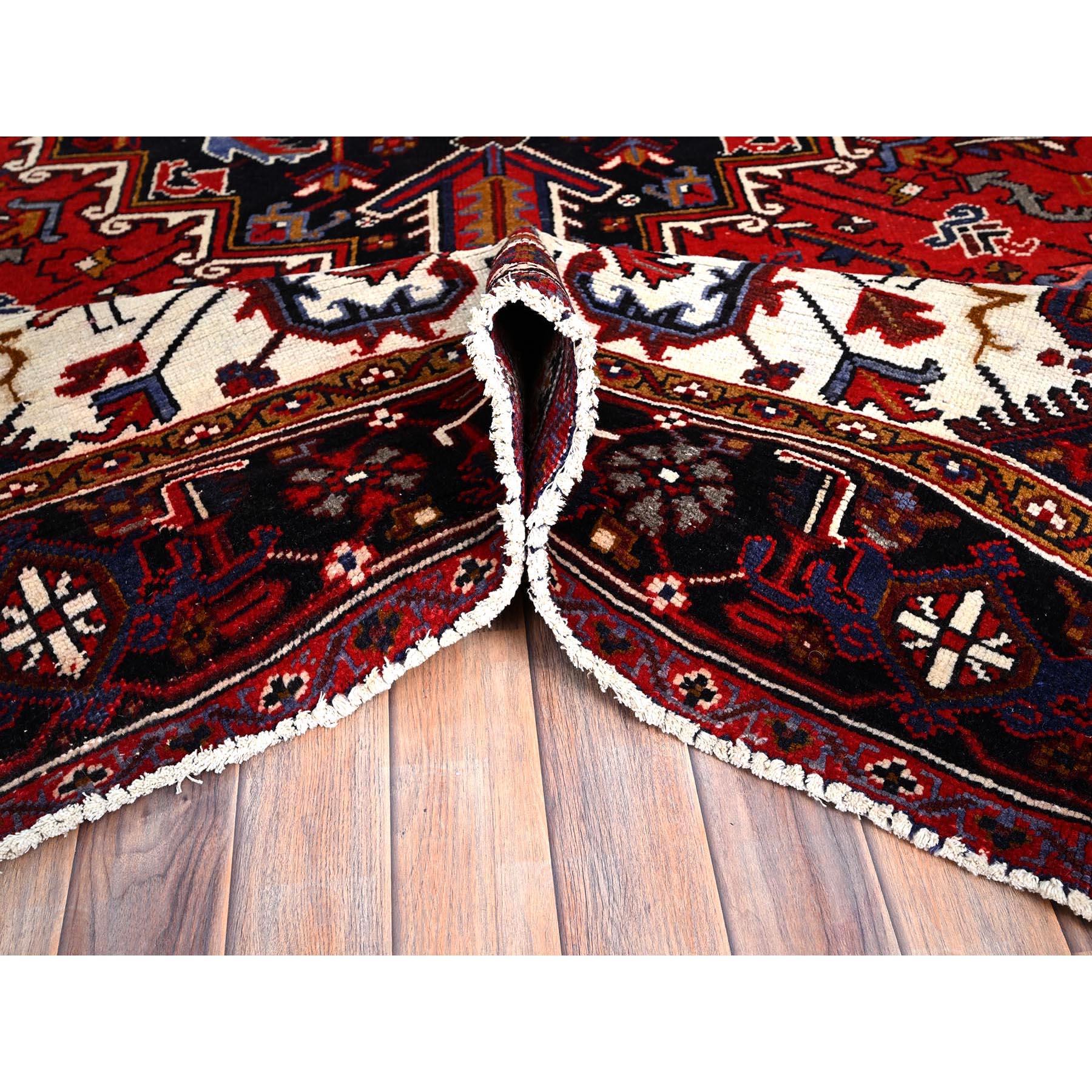Mid-20th Century Red Hand Knotted Worn Down Vintage Wool Persian Heriz with Tribal Ambience Rug For Sale