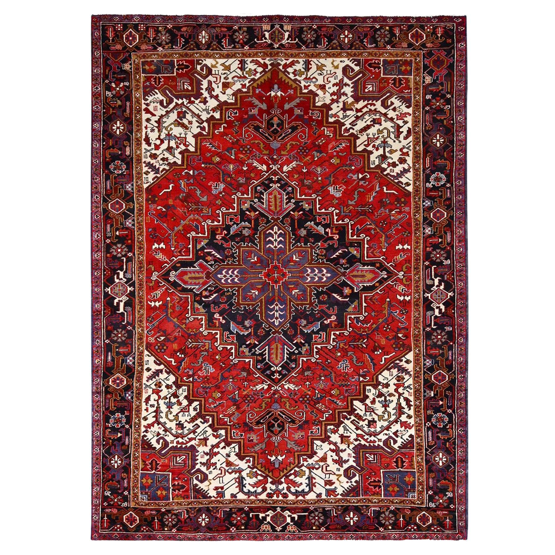Red Hand Knotted Worn Down Vintage Wool Persian Heriz with Tribal Ambience Rug For Sale
