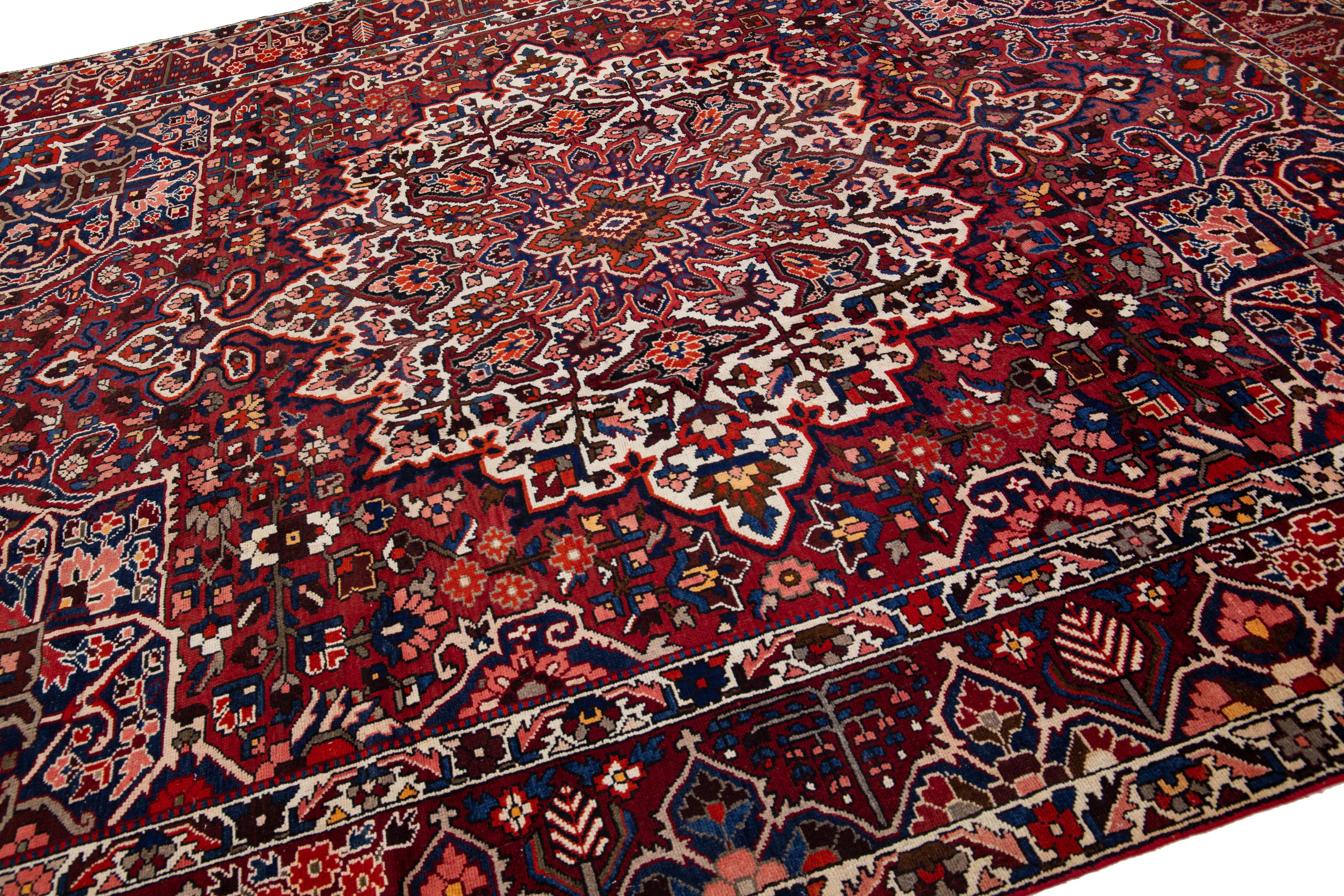 Islamic Red Handmade Antique Bakhtiari Persian Wool Rug with Medallion Motif For Sale