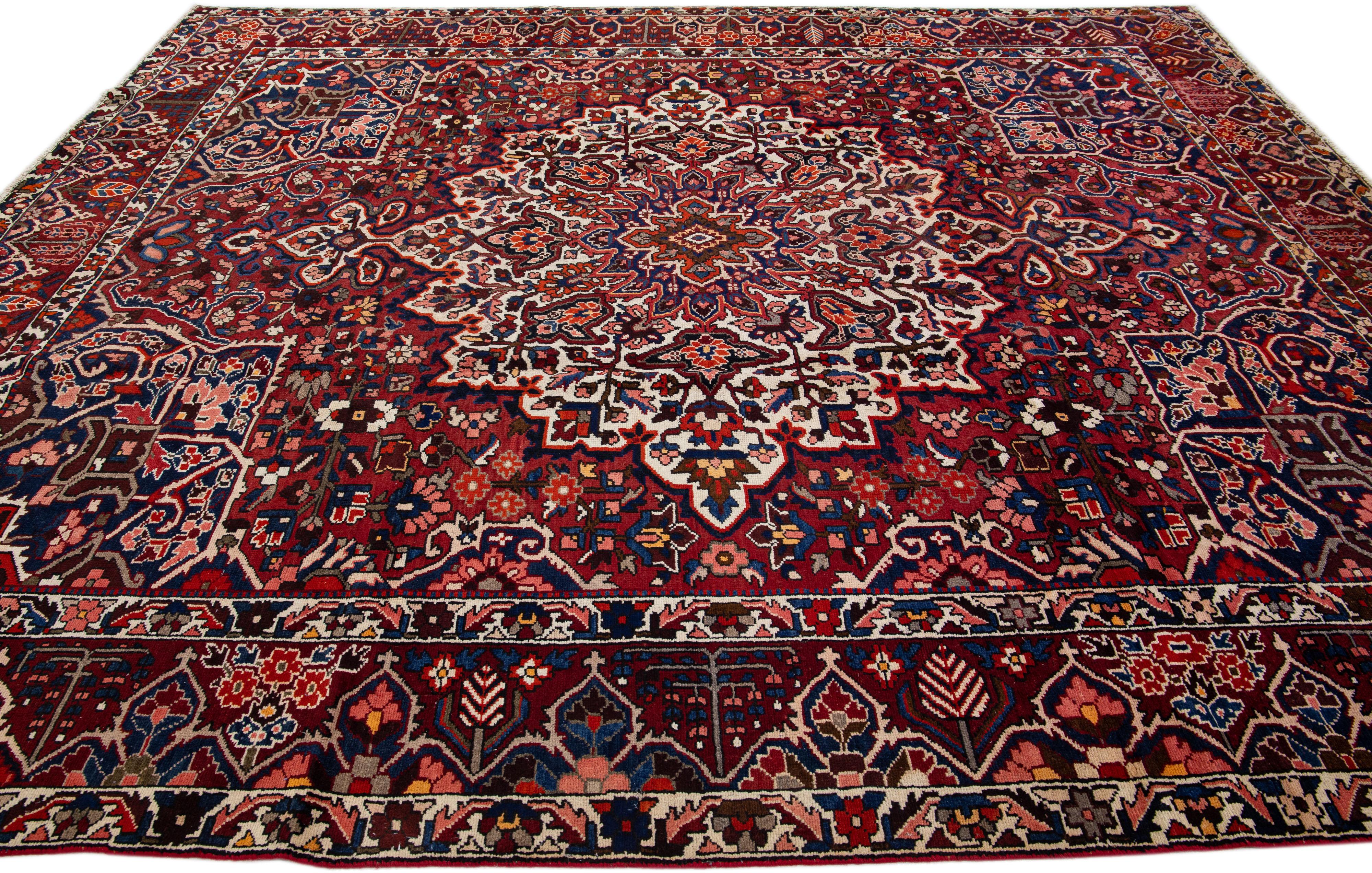 Red Handmade Antique Bakhtiari Persian Wool Rug with Medallion Motif In Good Condition For Sale In Norwalk, CT