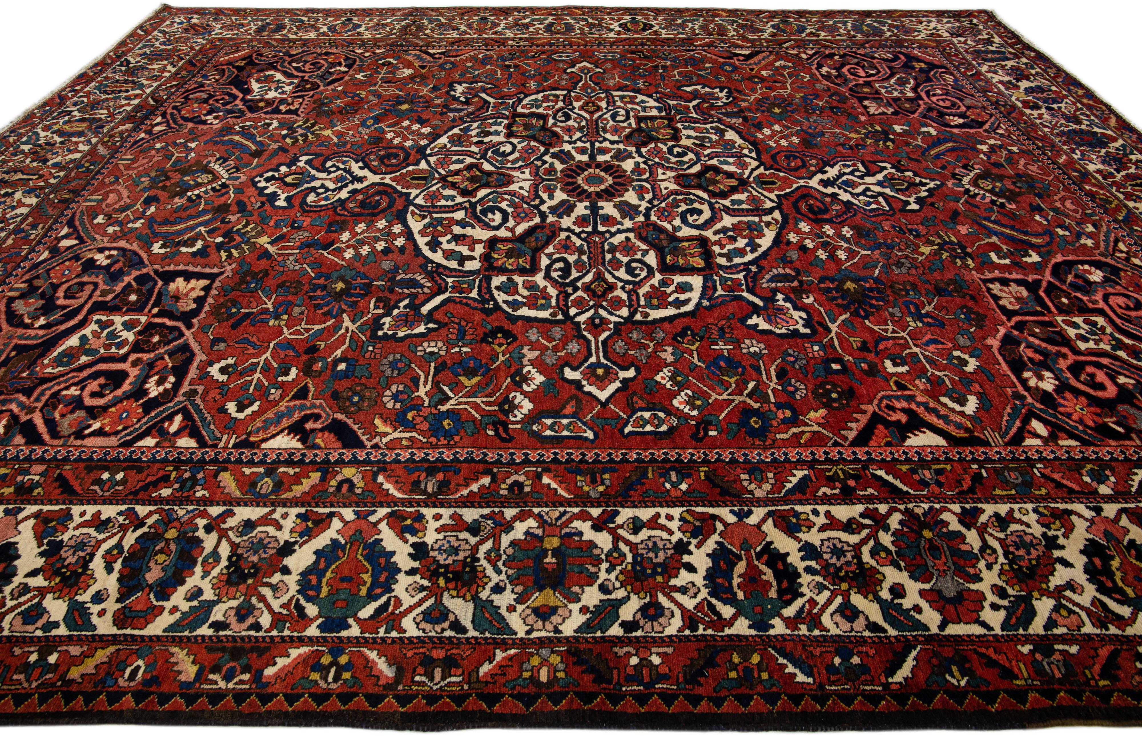 Red Handmade Antique Persian Bakhtiari Rosette Wool Rug  In Good Condition For Sale In Norwalk, CT