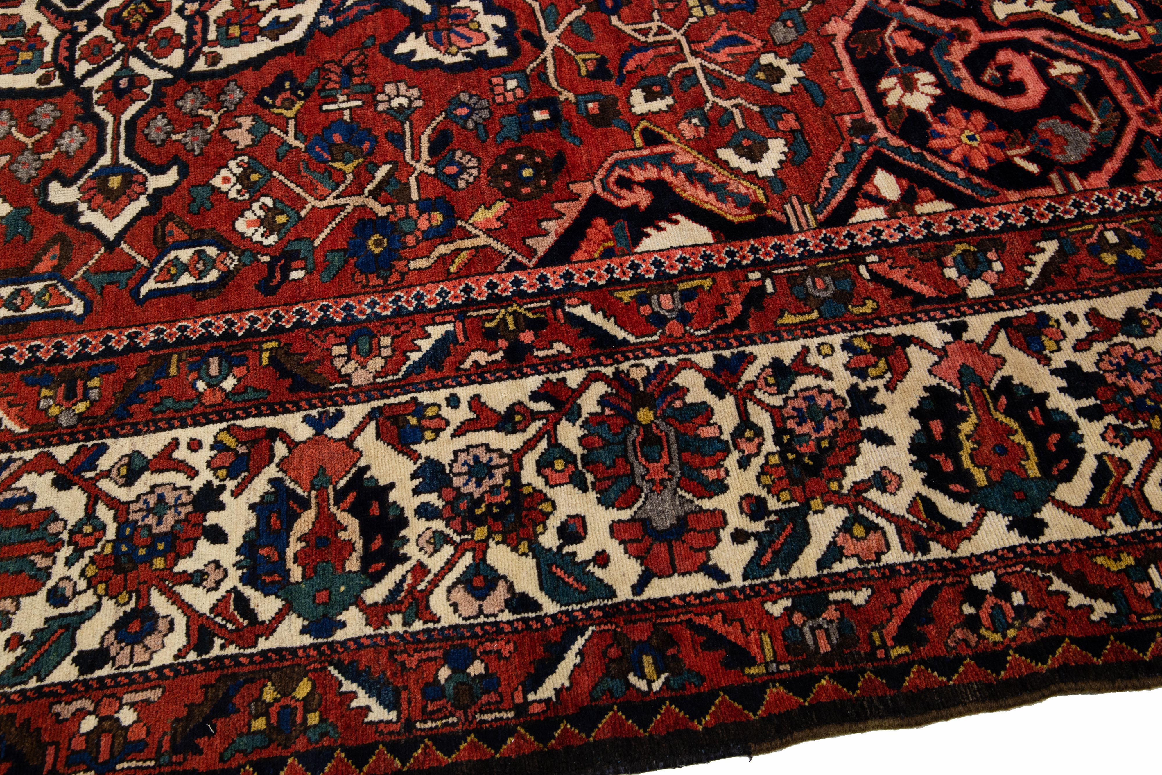 20th Century Red Handmade Antique Persian Bakhtiari Rosette Wool Rug  For Sale
