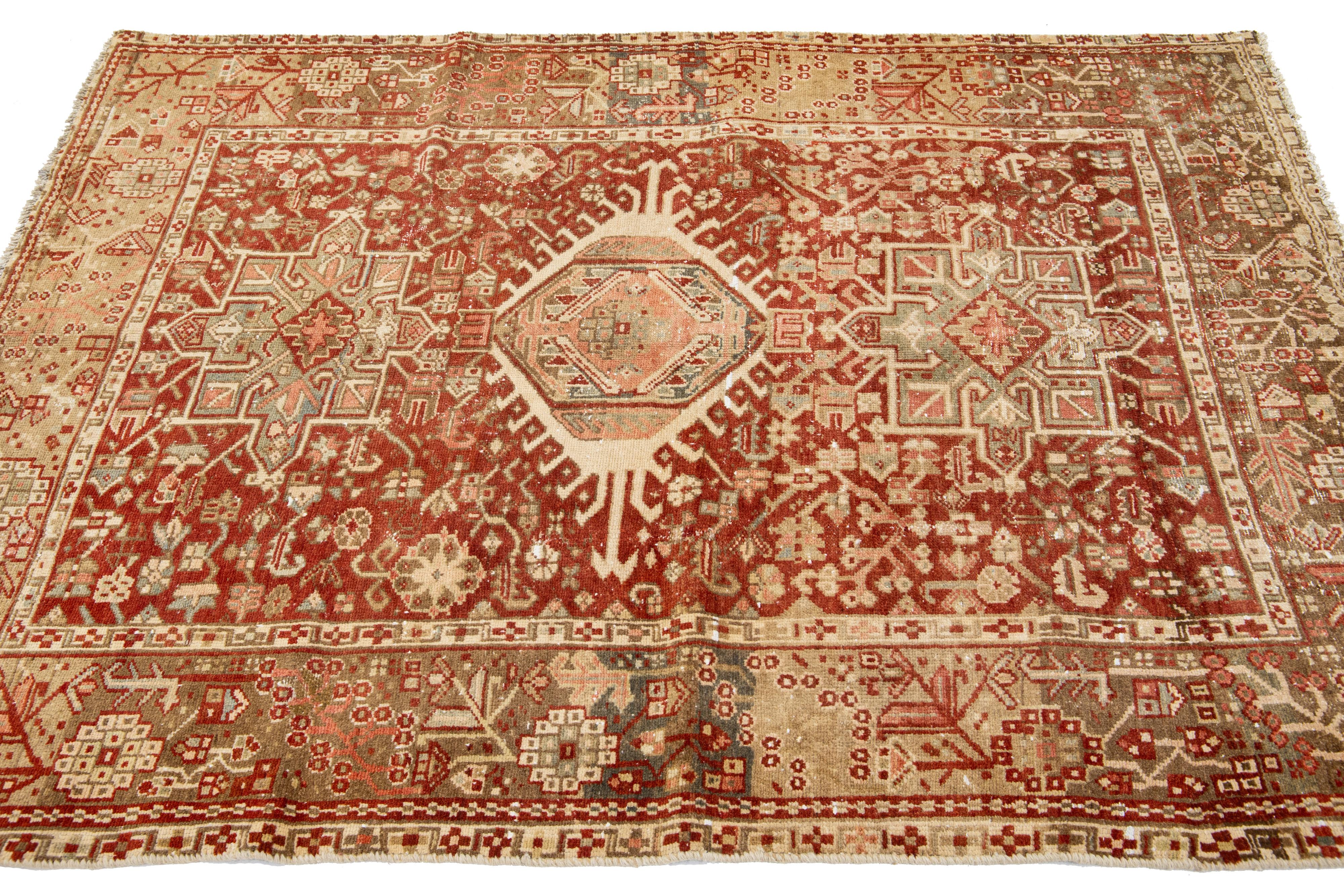 Hand-Knotted Red Handmade Antique Wool Rug Persian Heriz Featuring a Medallion Motif  For Sale