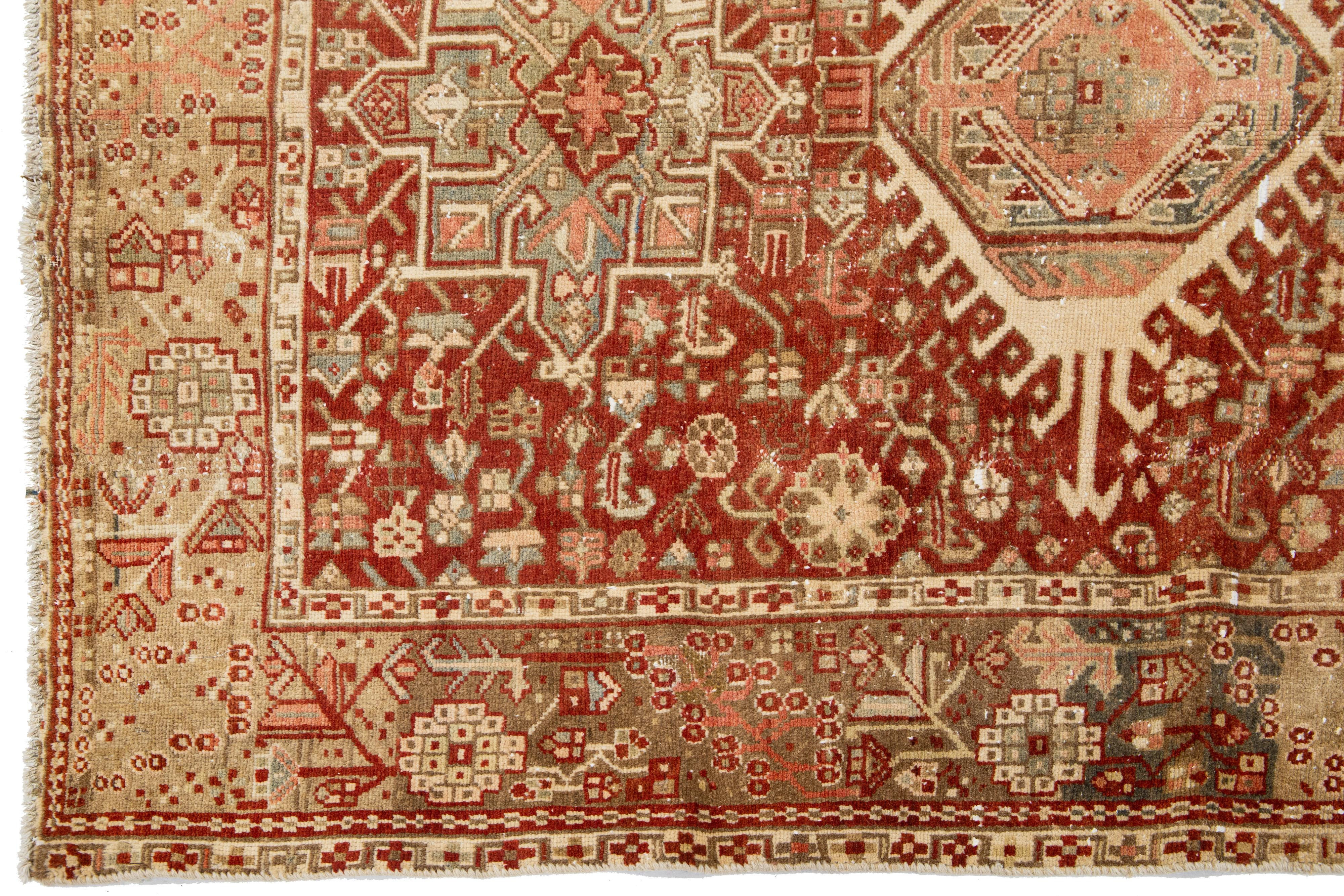 Red Handmade Antique Wool Rug Persian Heriz Featuring a Medallion Motif  In Good Condition For Sale In Norwalk, CT