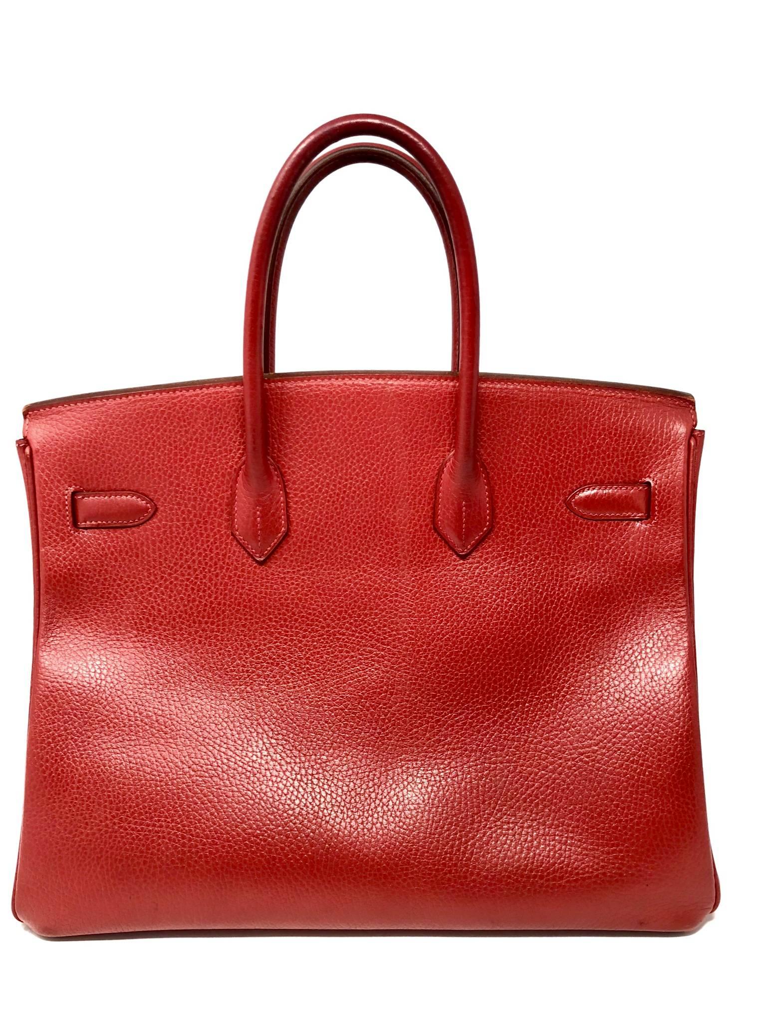 Red Hermes Birkin 35 with gold hardware from 2004. The handles have darkened over time as shown in the pictures. The body of the bag is in good vintage condition and stands well on it's own. 