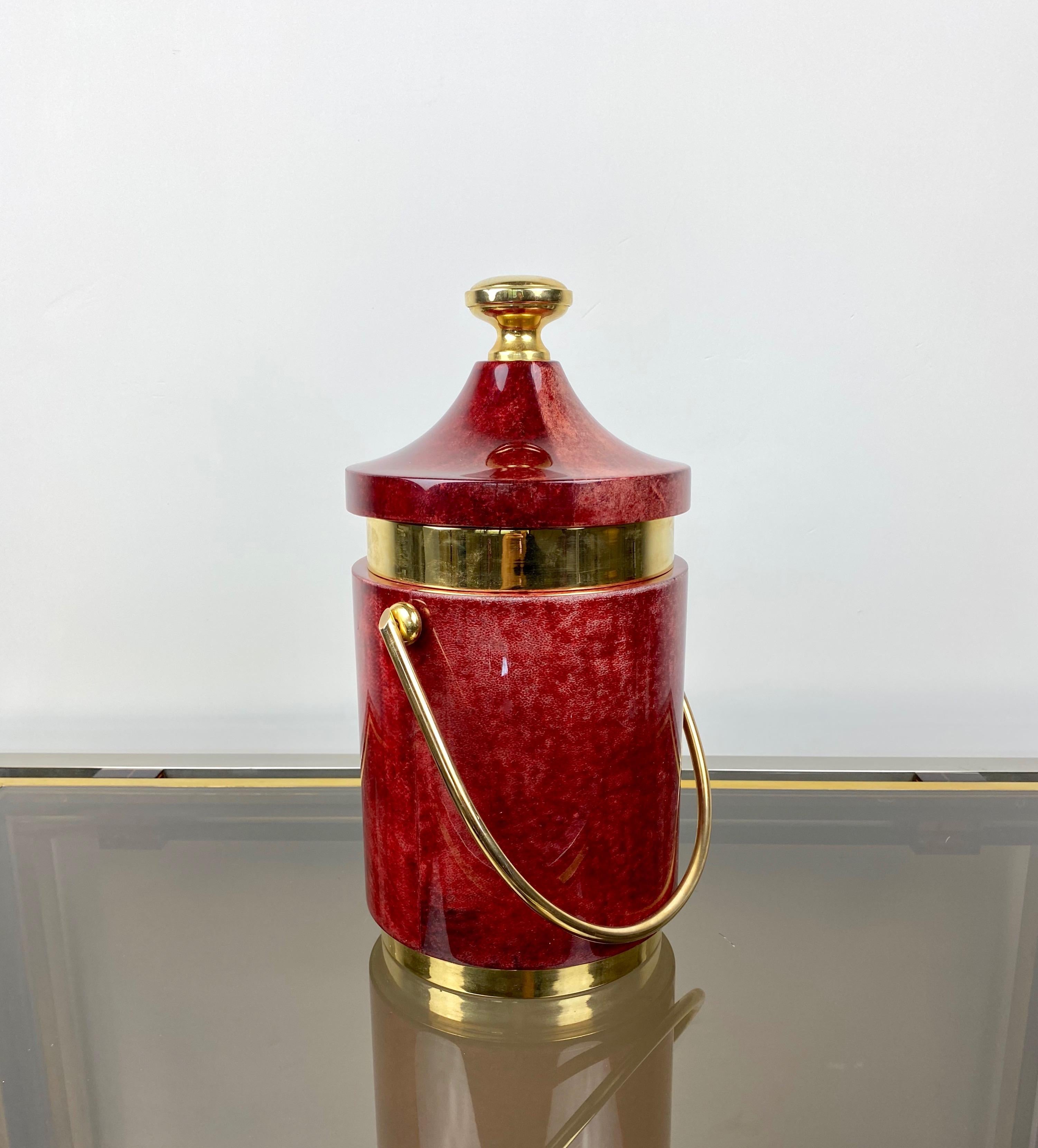 Ice bucket by the Italian designer Aldo Tura (original label still attached - Tura Creazioni) in red goatskin and brass details, 1960s.
