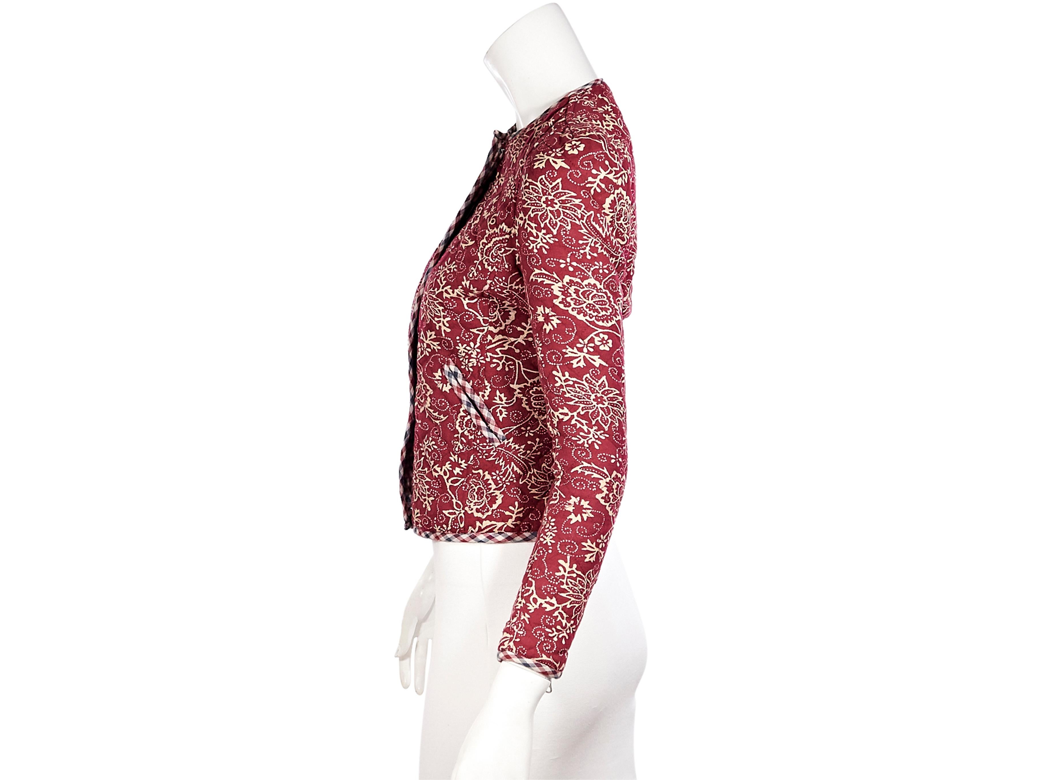 Product details:  Red floral quilted cotton jacket by Isabel Marant Etoile.  Features plaid trim.  Crewneck.  Long sleeves.  Concealed zip-front closure.  Waist slide pockets.  32