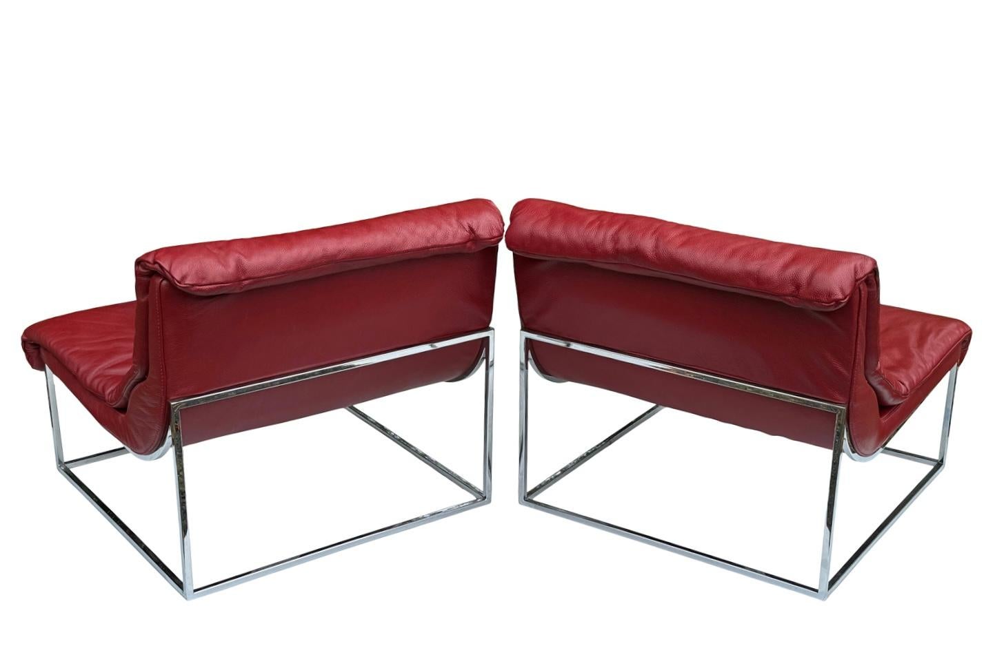 Two very comfortable authentic Italian leather lounge, chairs with thin chrome bases which gives the room a very nice open feeling