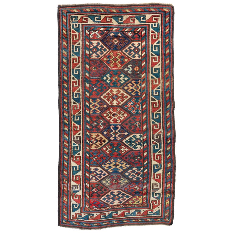 Red Ivory Navy Blue Tribal Geometric Caucasian Kazak Rug, circa 1880