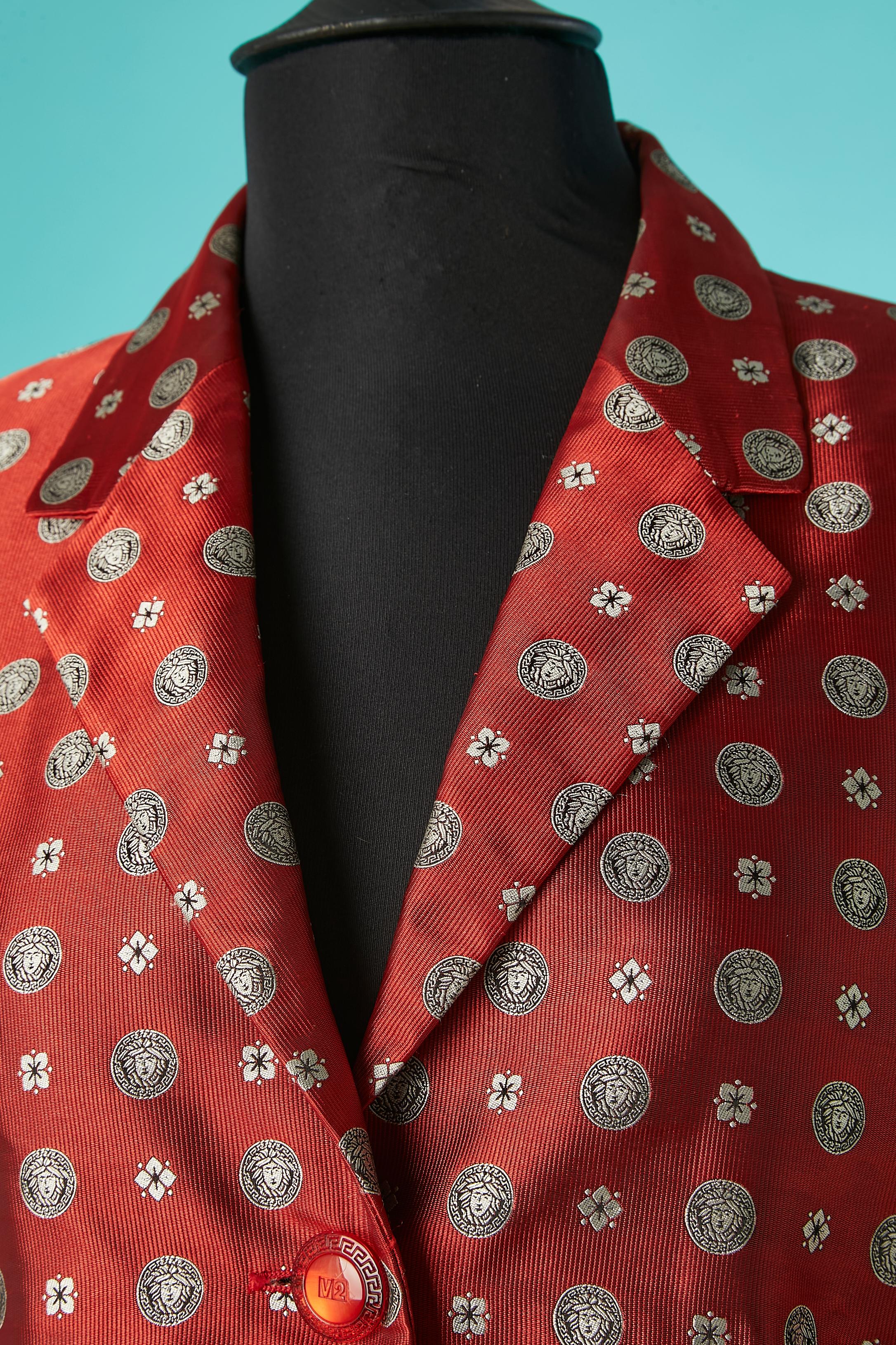 Red jacquard single-breasted jacket with Medusa and flower pattern. Branded 