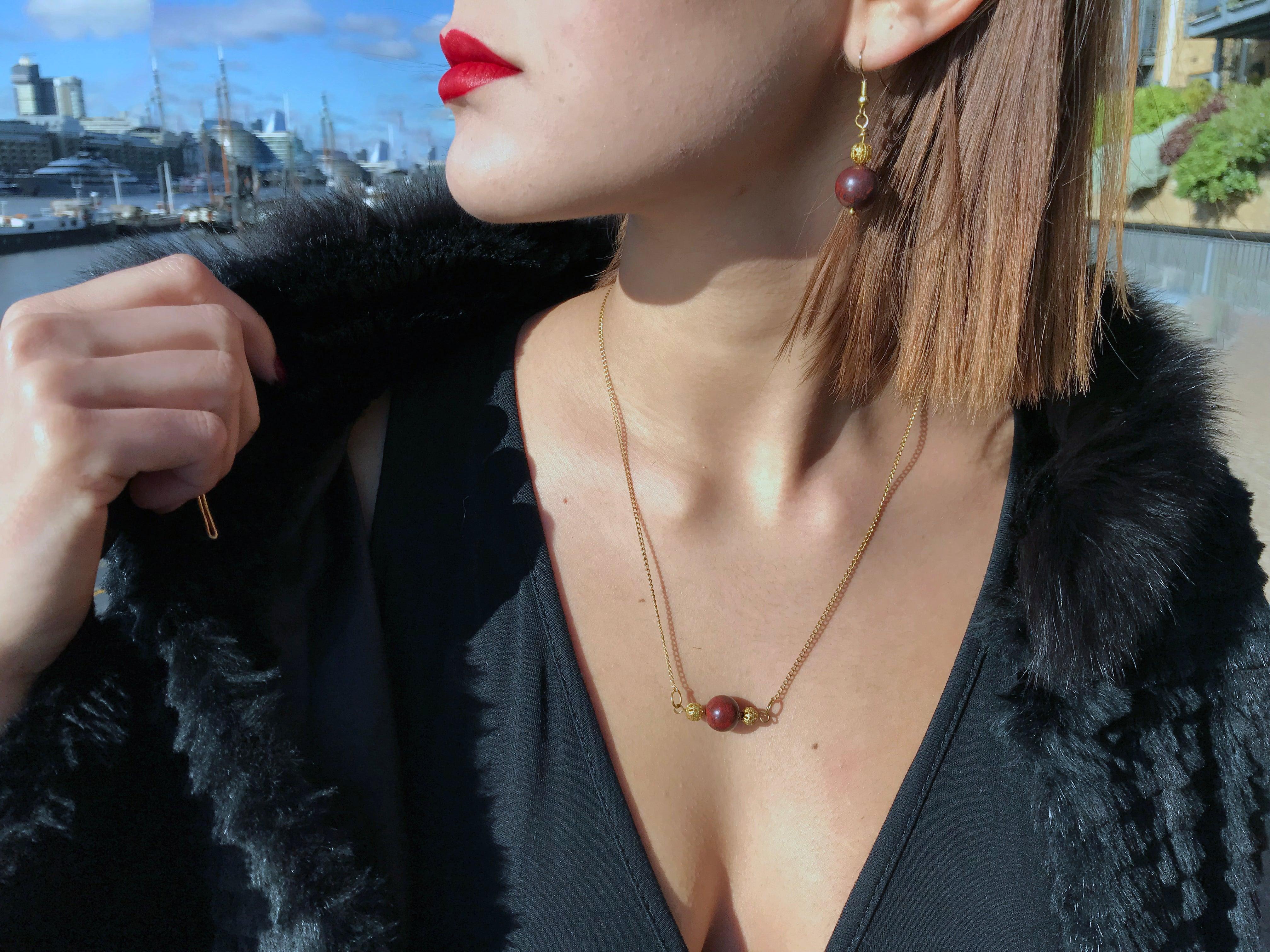 Indulge in the beauty of natural gemstones with our stunning Jasper Gold Vermeil Earrings. Handcrafted with care, these earrings feature vibrant red jasper gemstones that are delicately attached to golden filigree beads.

The warm golden hue of the