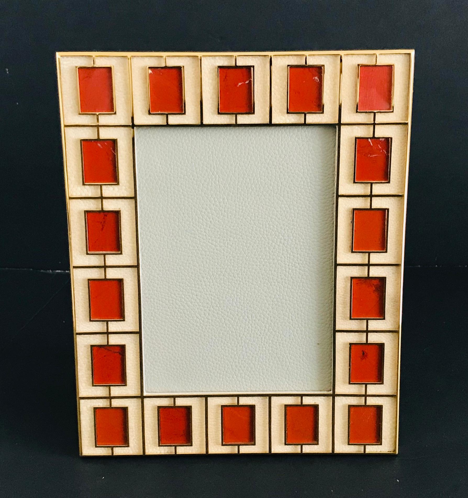 Ivory shagreen leather with red jasper stones and gold-plated picture frame by Fabio Ltd
Height: 10.5 inches / Width: 8.5 inches / Depth: 1 inch
Photo size: 5 inches by 7 inches
LAST 1 in stock in Los Angeles
Order Reference #: FABIOLTD PF34
This