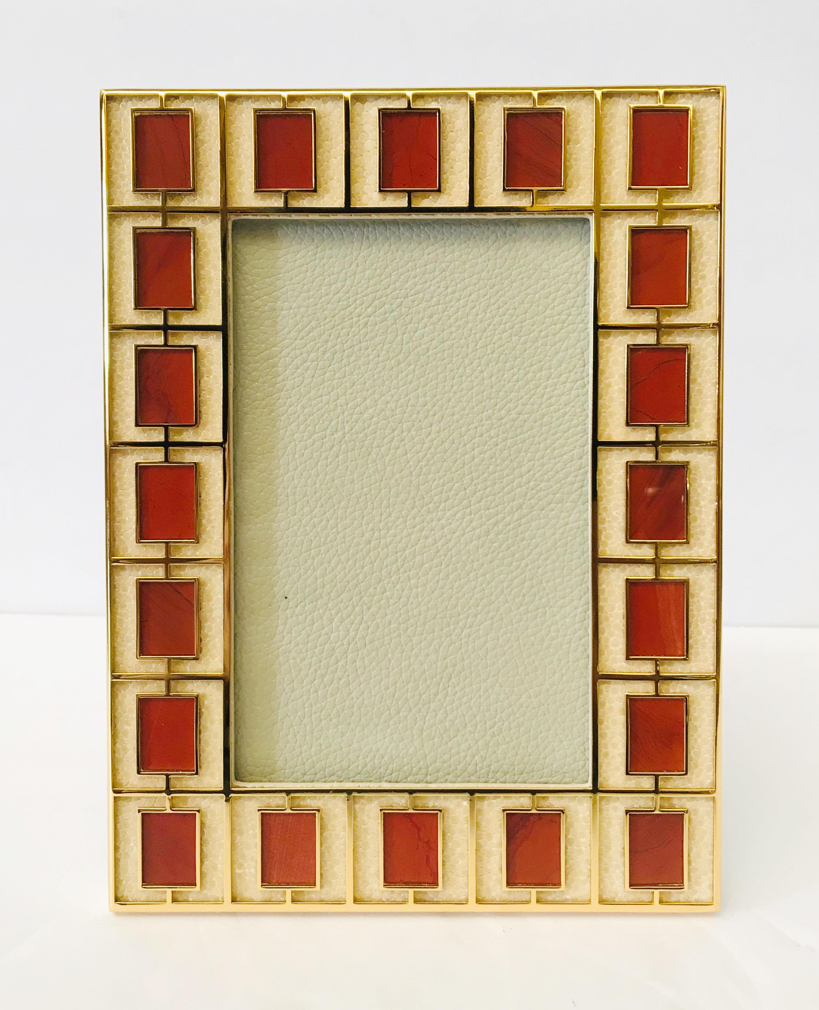 Ivory shagreen leather with red jasper stones and gold-plated picture frame by Fabio Ltd
Measures: Height 8 inches / width 6 inches / depth 1 inch
Photo size: 4 inches by 6 inches
LAST 1 in stock in Los Angeles
Order Reference #: FABIOLTD PF35
This
