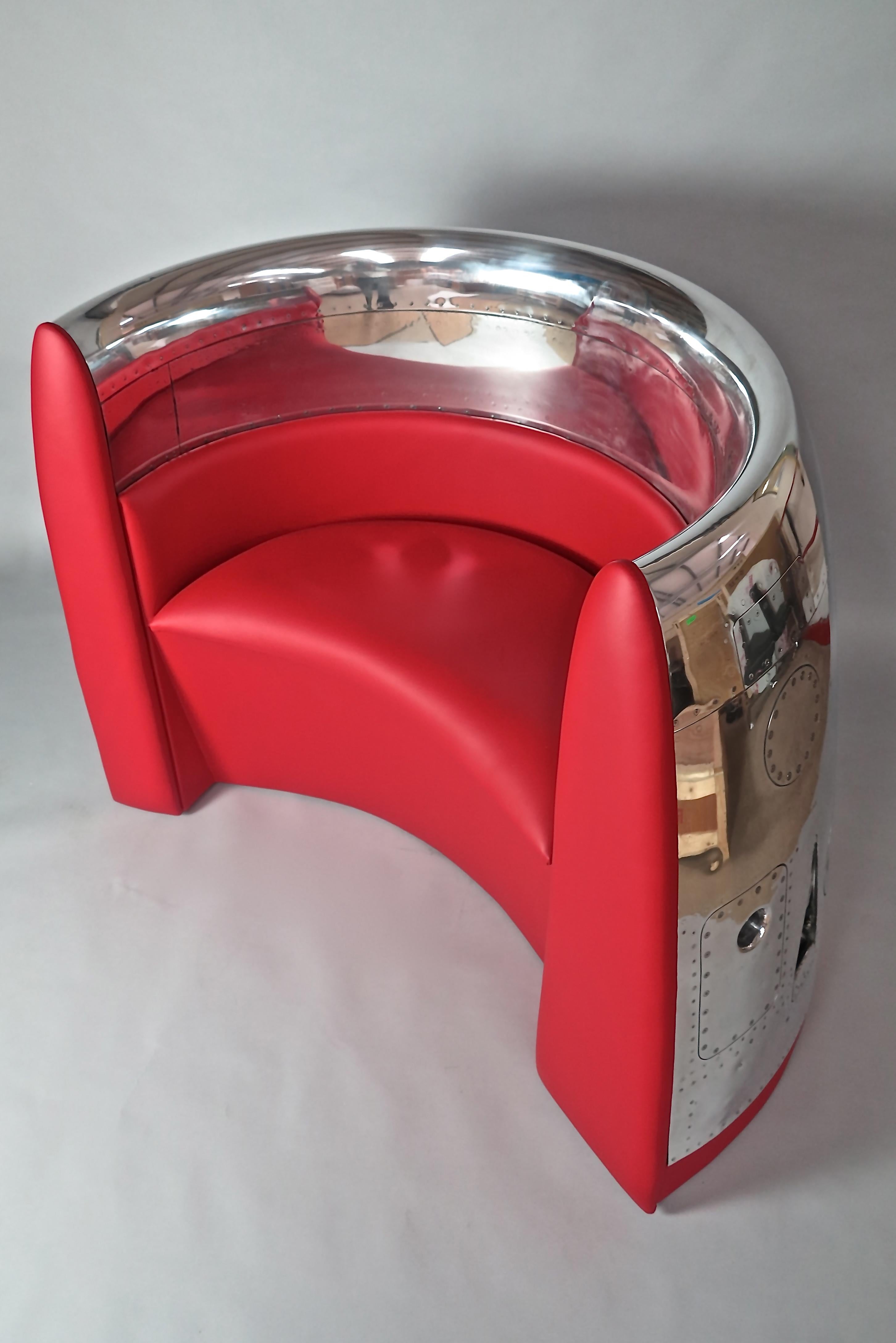 A highly polished jet cowling with a custom built premium leather red seat.

Many hours of skilled polishing, fine carpentry and upholstery creates a contemporary design seat for one or two persons.

 