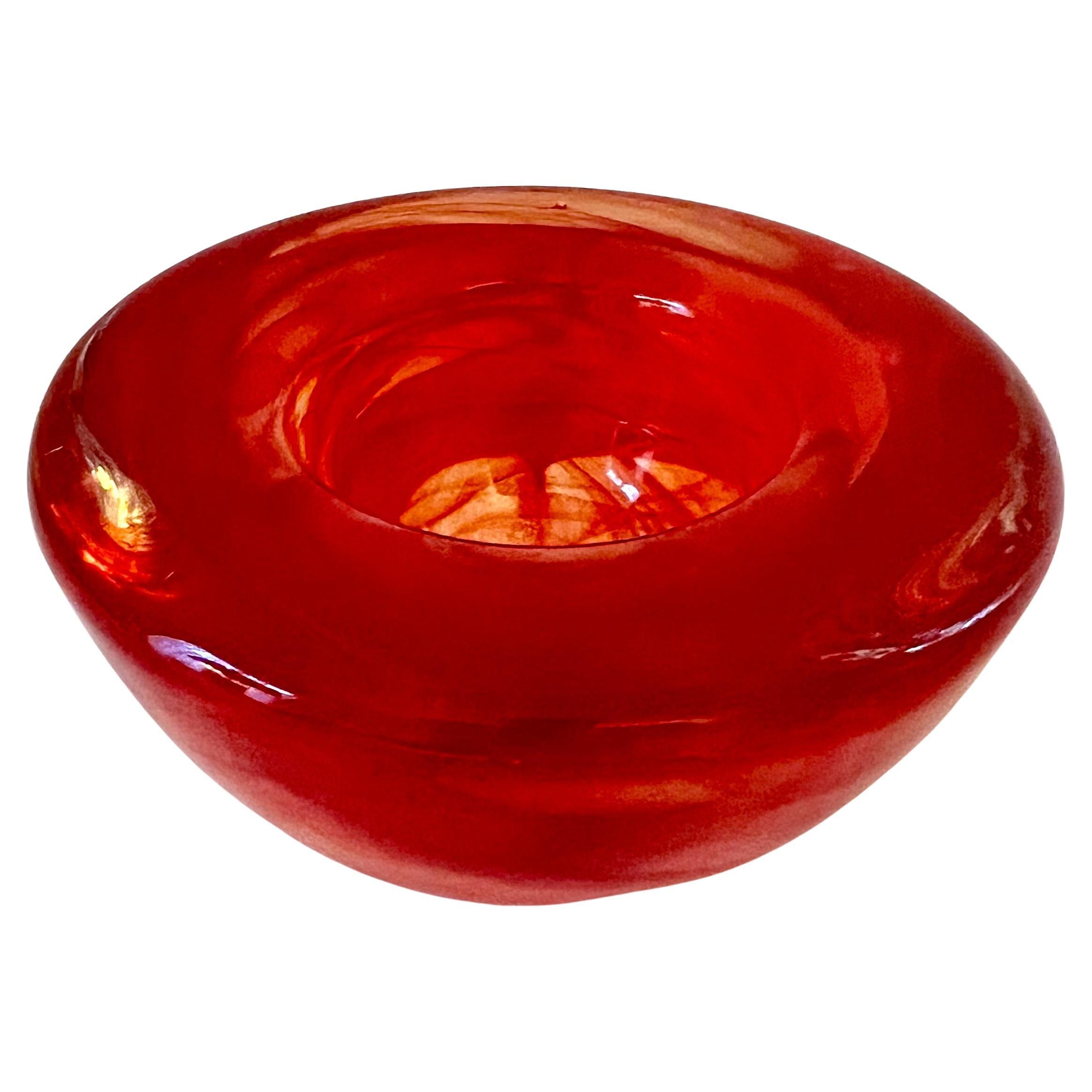 A very colorful hand crafted blown glass bowl by Anna Ehrner for Kosta Soda.

The bowl is small but has a great look and statement. - could be used for multiple purposes, including a votive, office supplies at a work station, floating a bud or desk