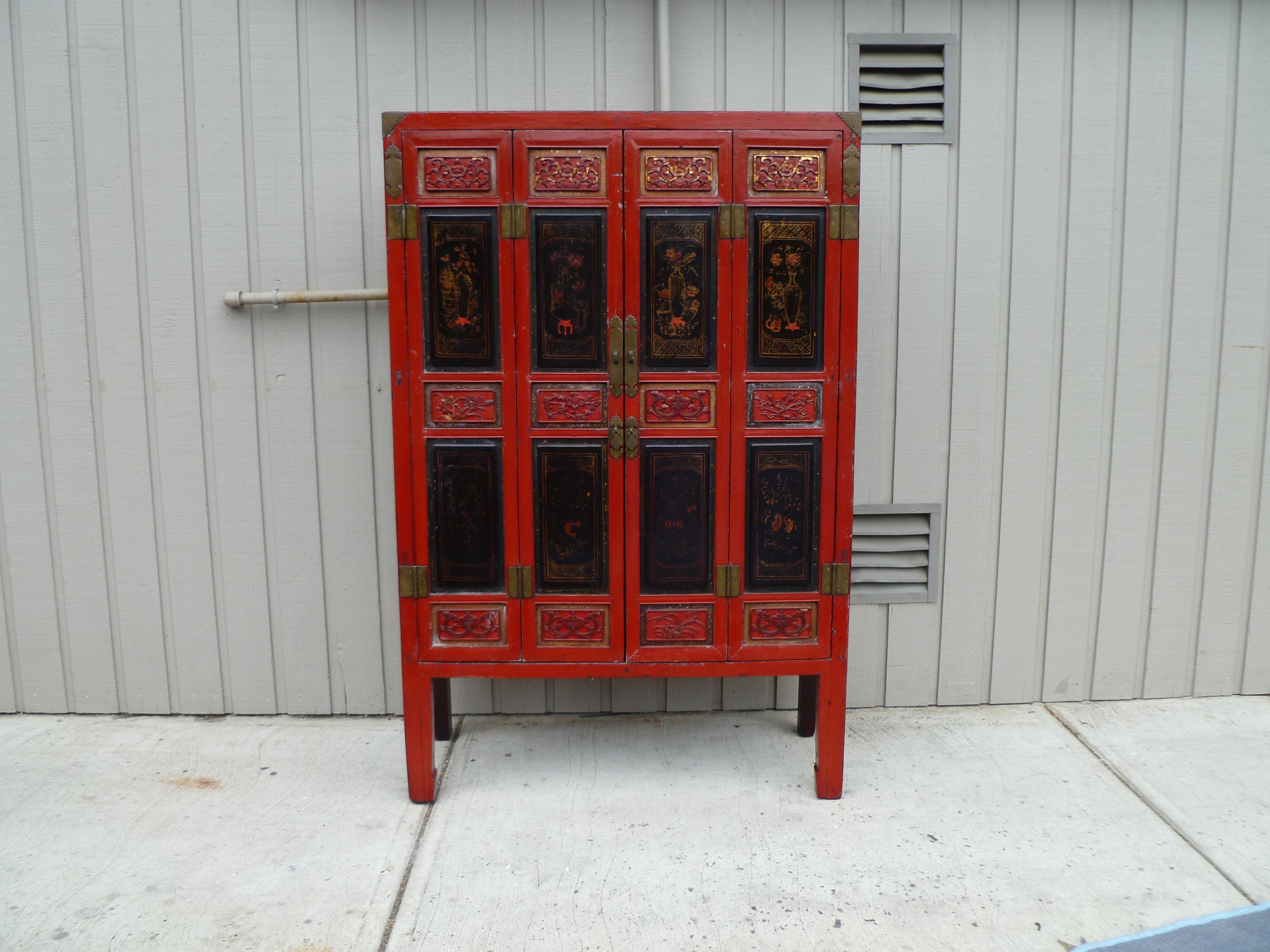 Qing Red Lacquer Armoire with Relief Carving & Gilt Motif For Sale