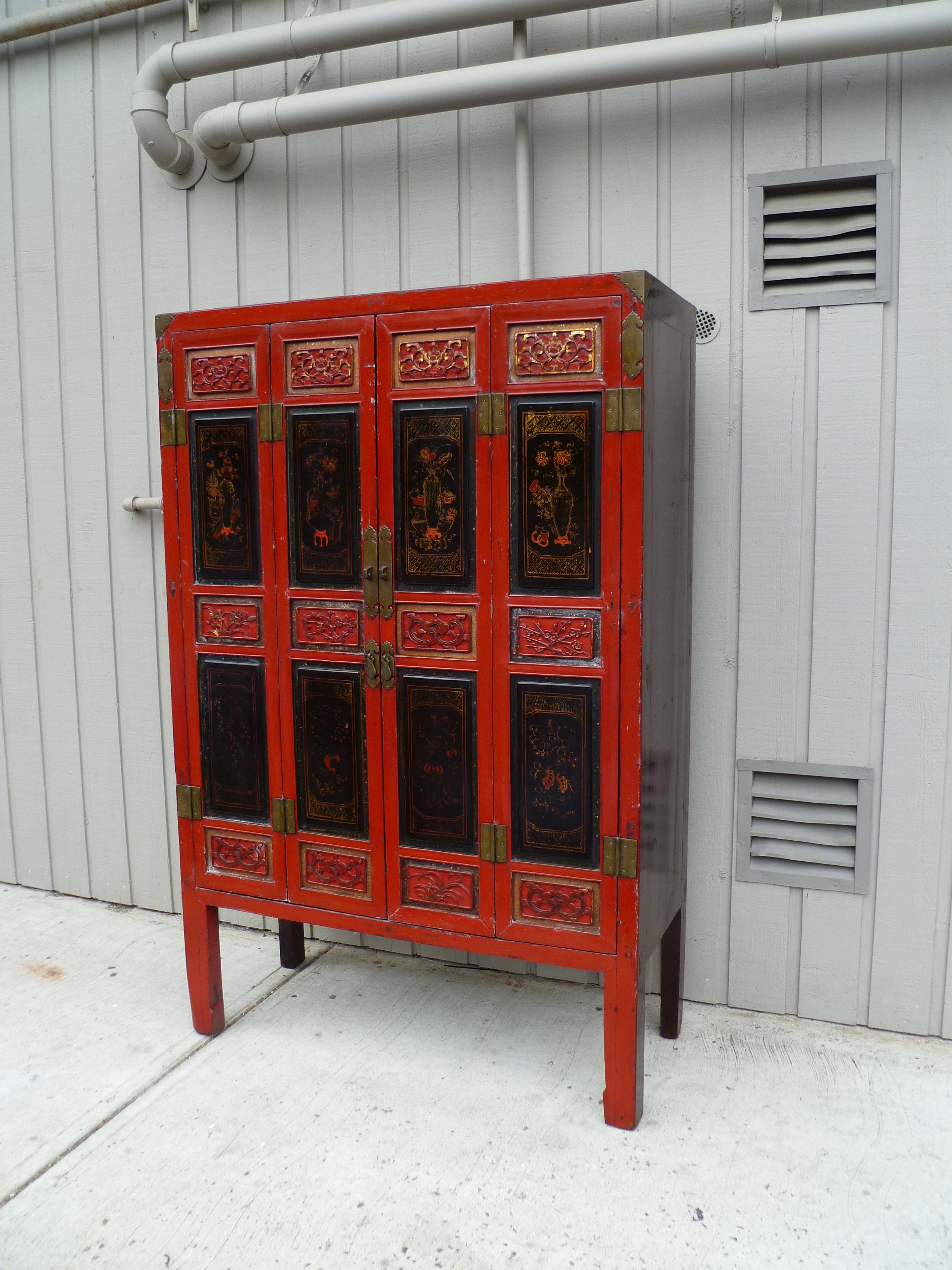 Hand-Painted Red Lacquer Armoire with Relief Carving & Gilt Motif For Sale