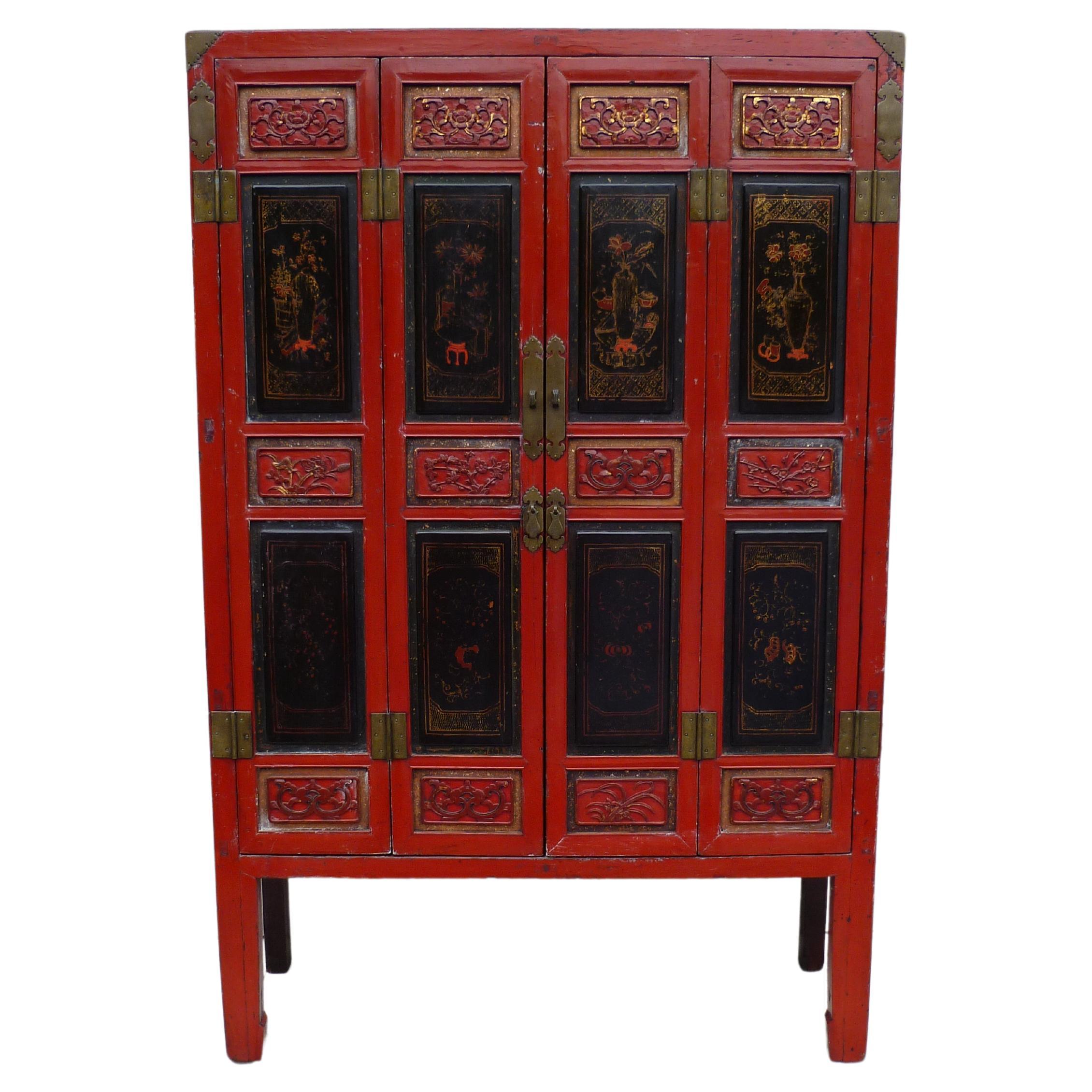Red Lacquer Armoire with Relief Carving & Gilt Motif For Sale