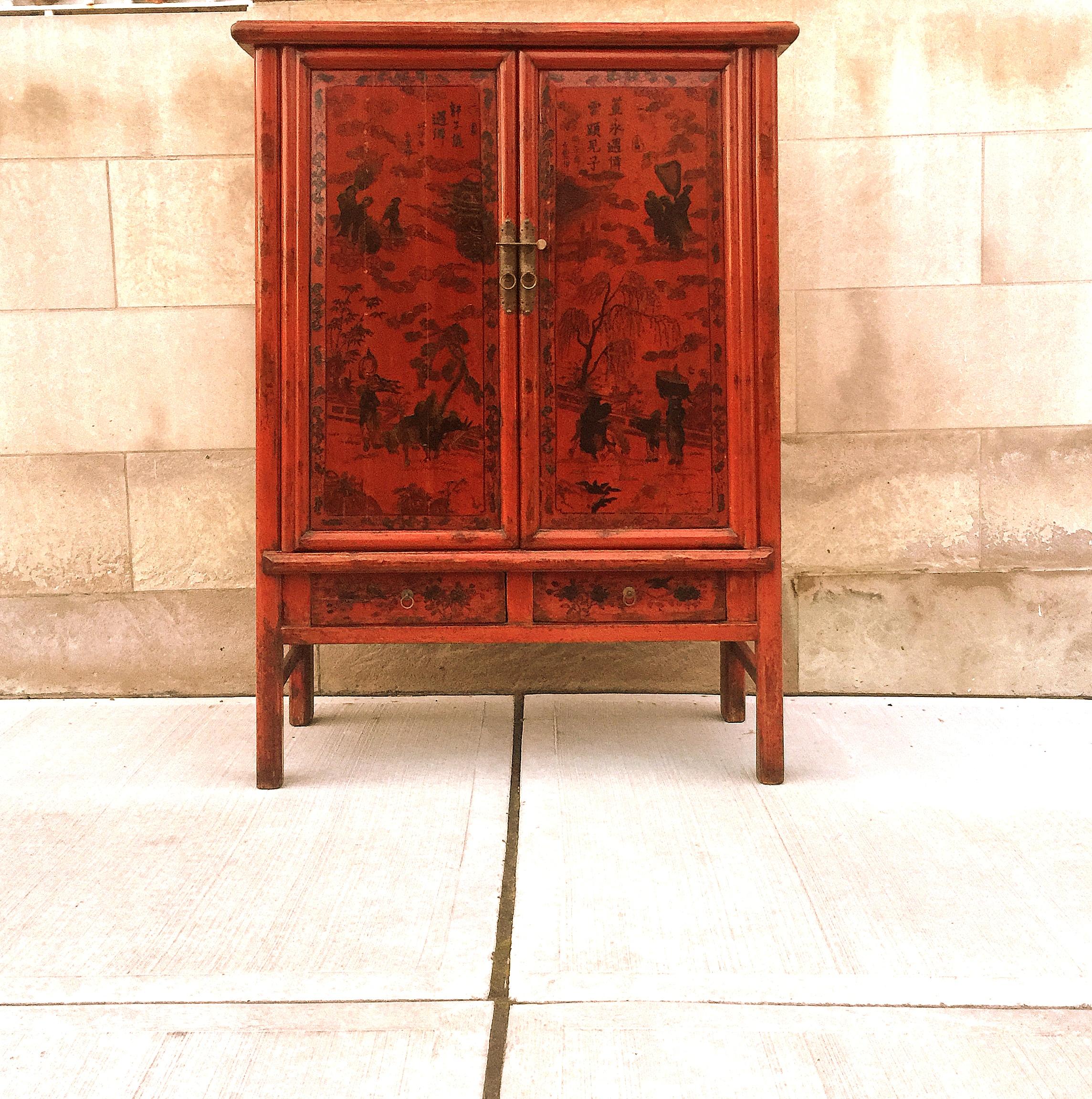 Red lacquer cabinet with painted motif and painted calligraphy. Two drawers inside and one removable shelf. We carry fine quality furniture with elegant finished and has been appeared many times in 