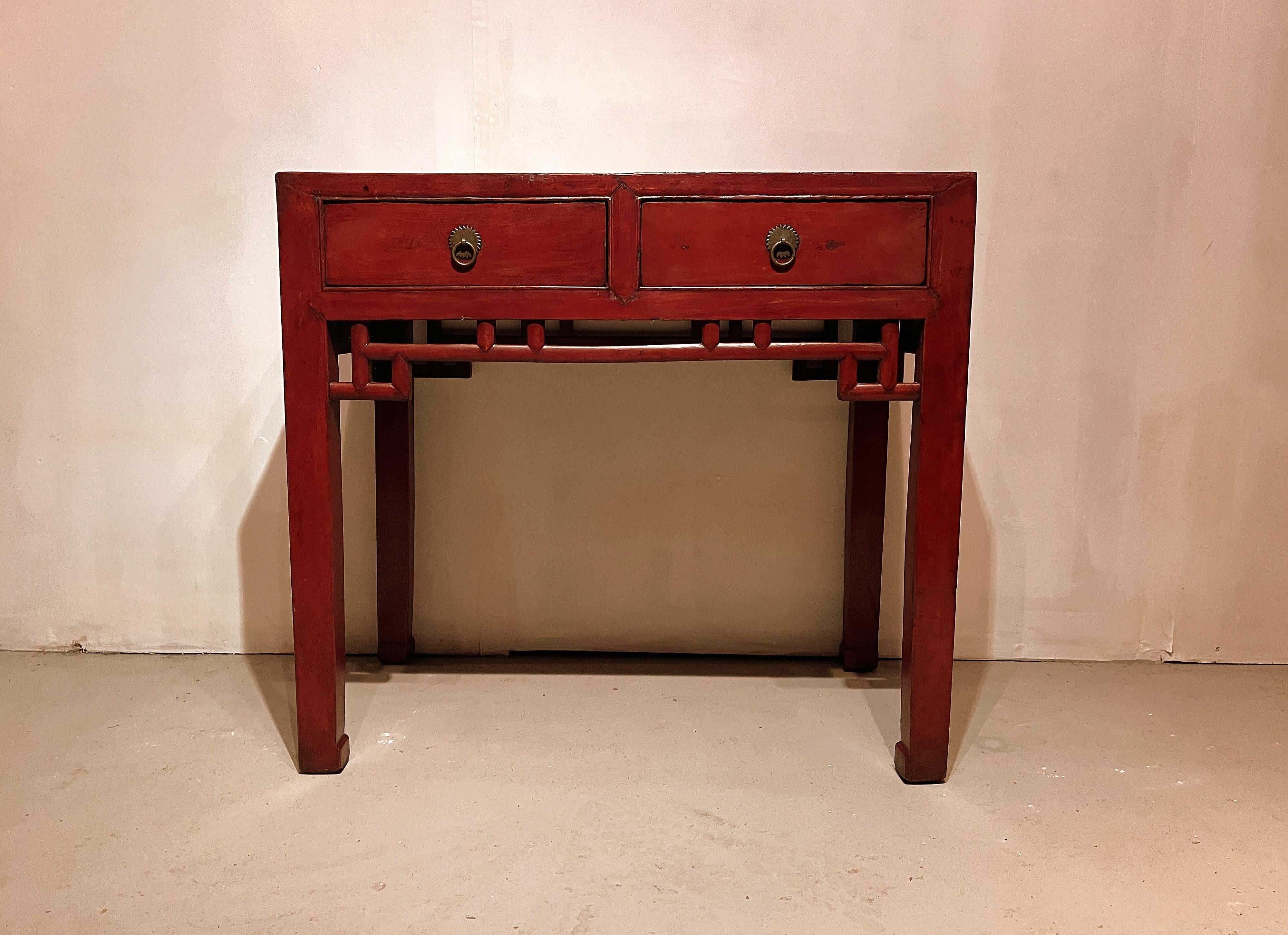 Red lacquer desk with two drawers with stretchers apron 