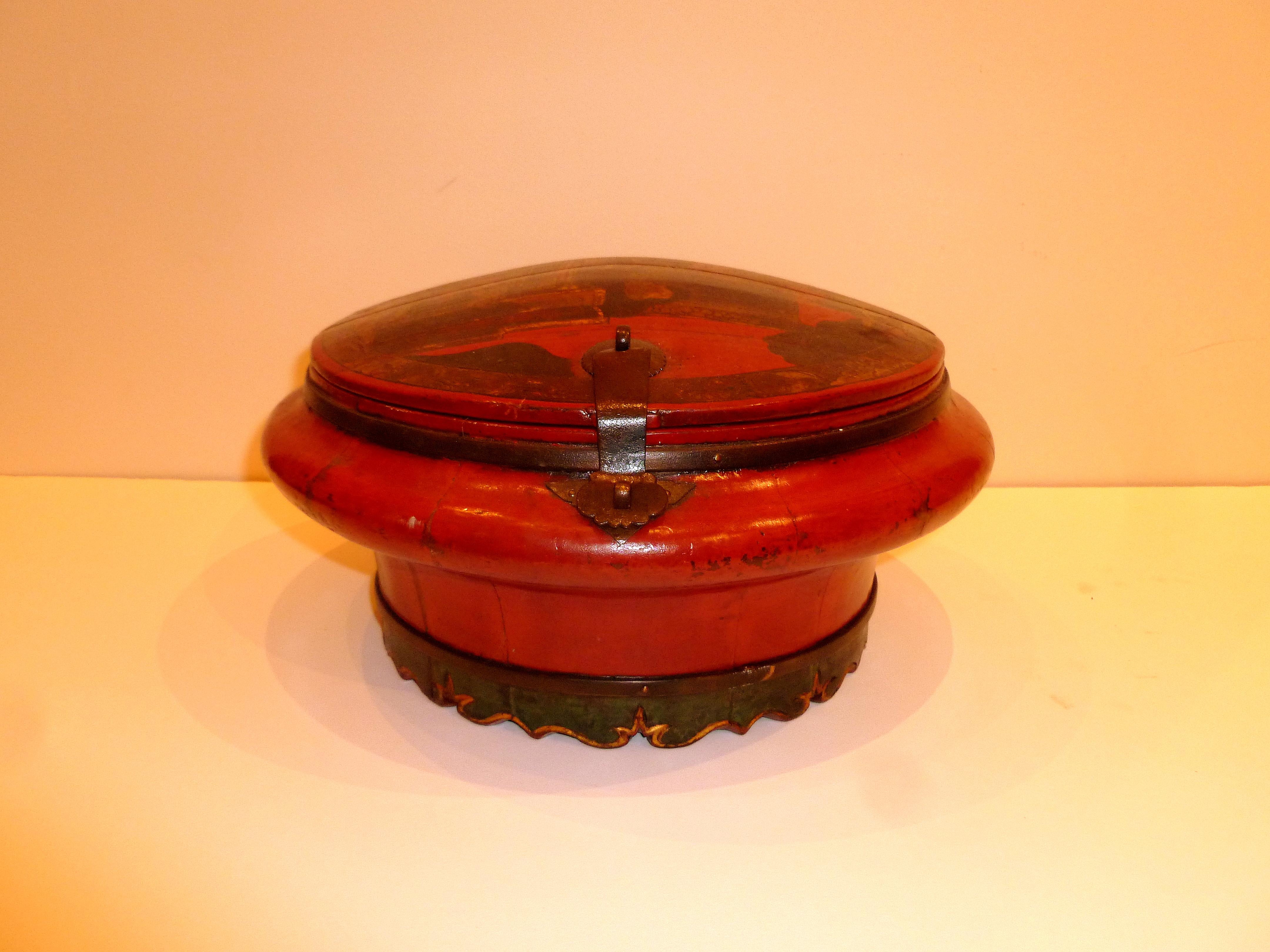 Red lacquer wedding container with painted garden motif top and metal bracket