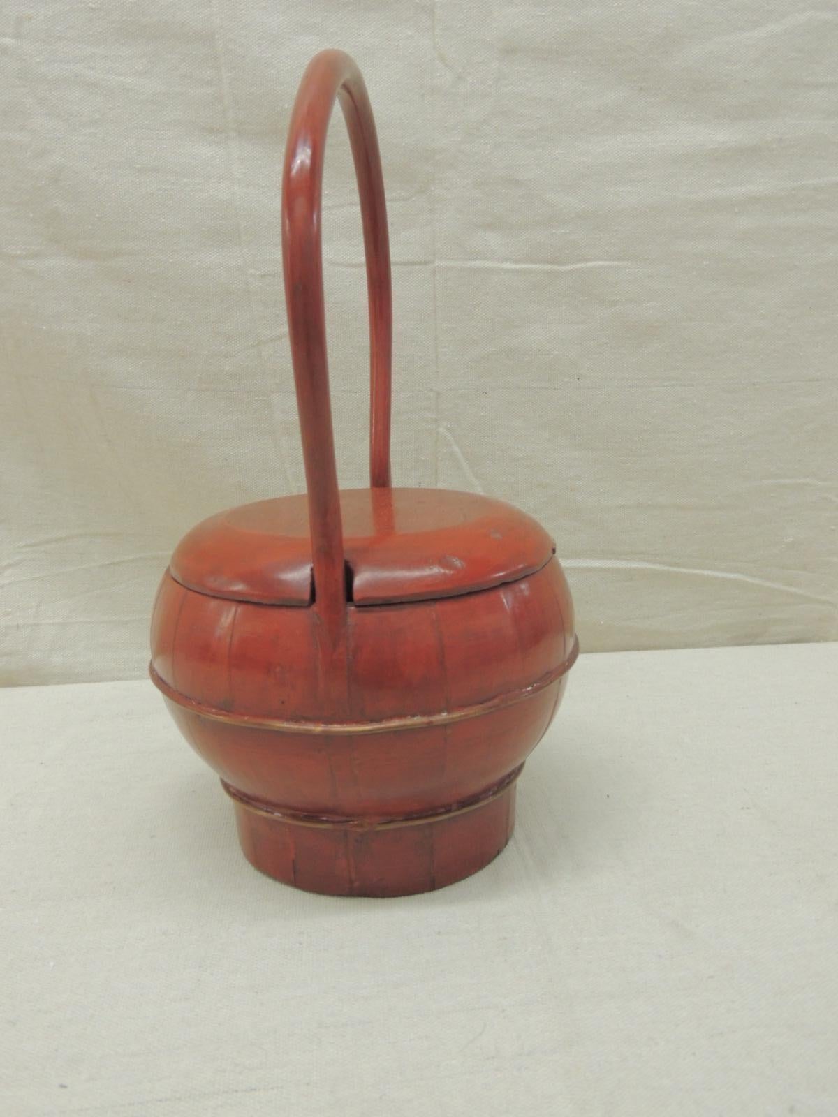 Red lacquered Asian basket with lid
Size: 13” H x 7” W x 7” D.

   