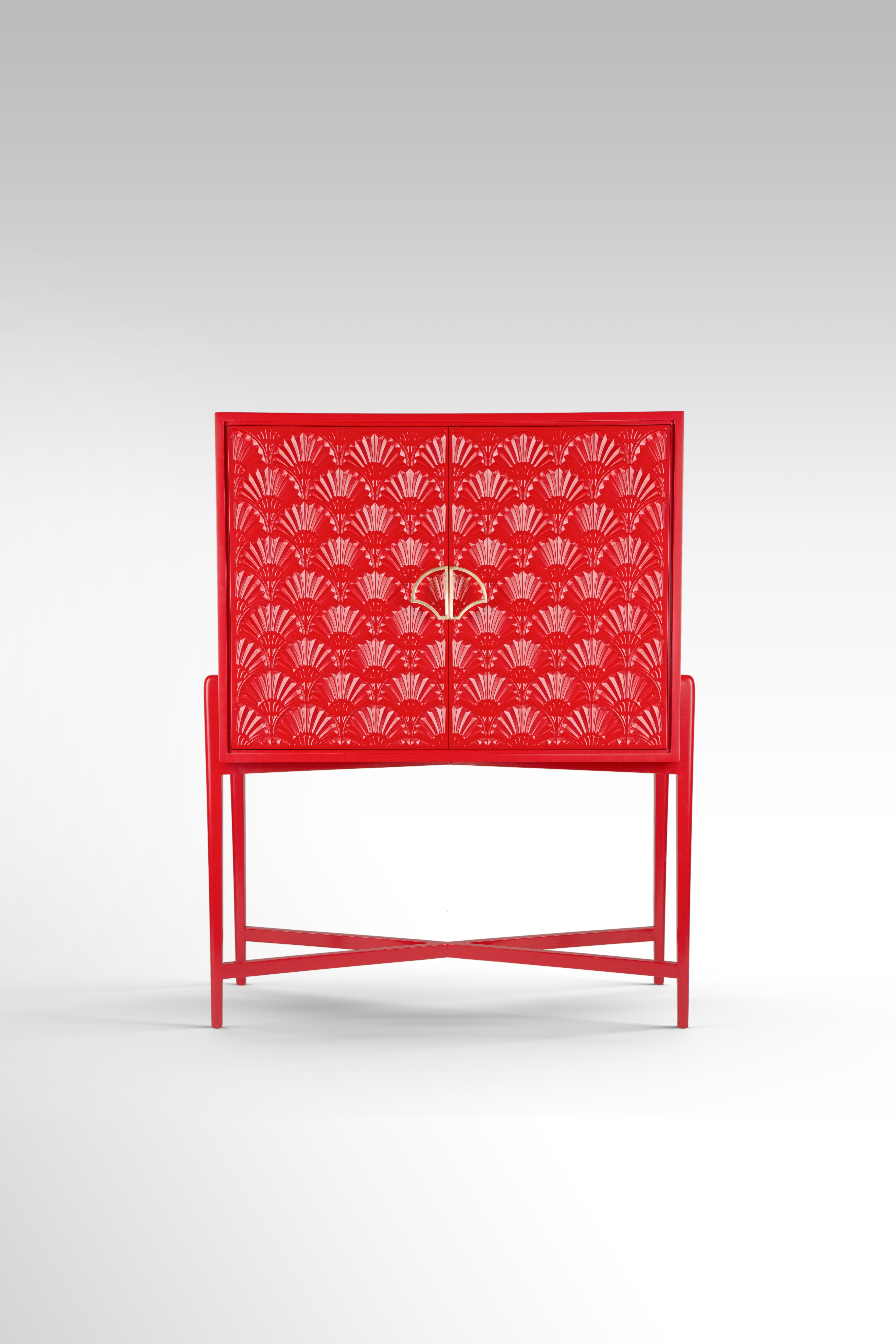Red Lacquered Cocktail Cabinet with Carved Lotus Motif and Brass Lotus Handle. 
A contemporary twist to the beautiful lotus motif inspired from our Pharaonic heritage. Our For The Love of Lotus cabinet is designed with a recurring pattern of the